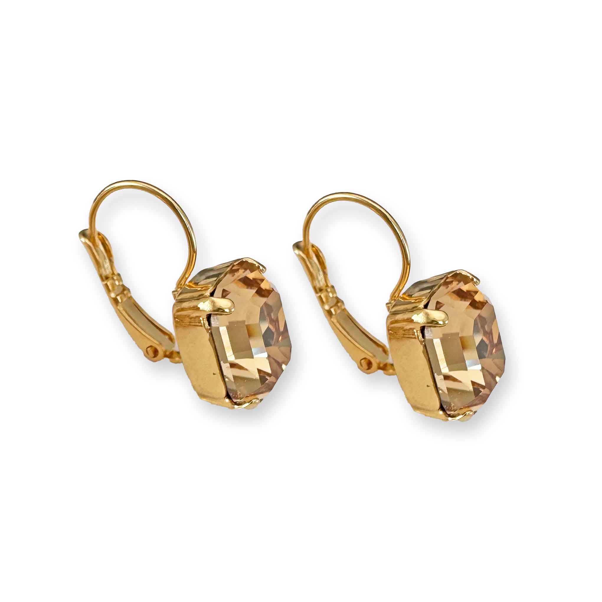 Side view of gold and light Colorado topaz crystal drop earrings.
