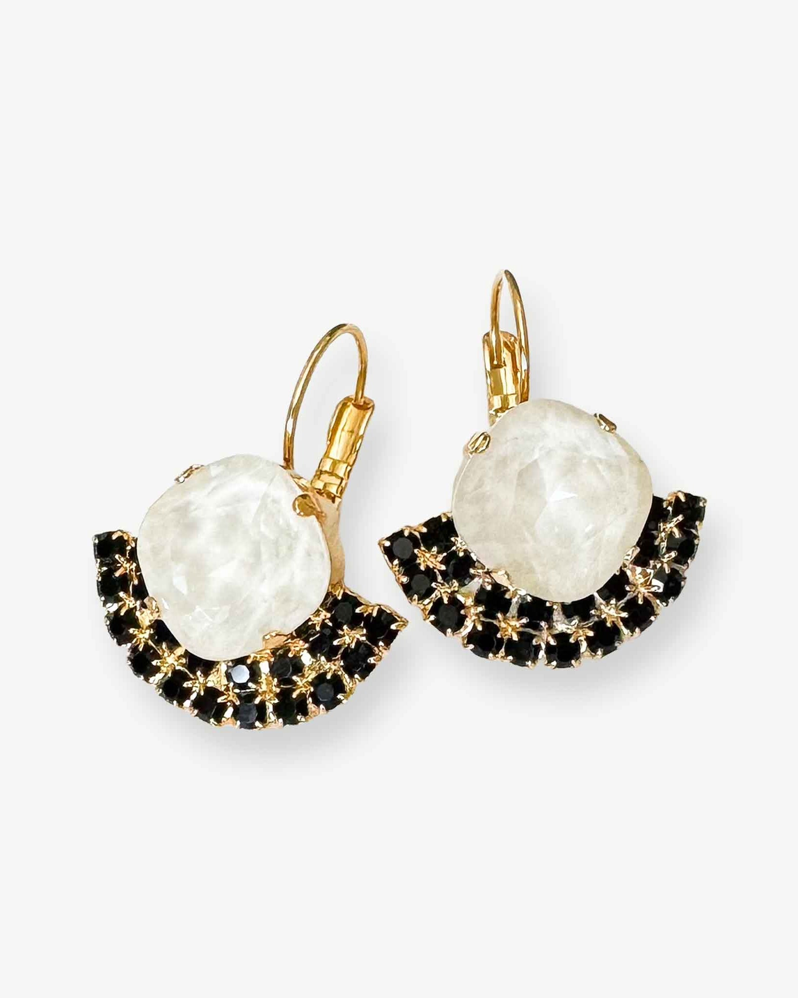 Black and white European crystal fan-shaped earrings shown in gold.