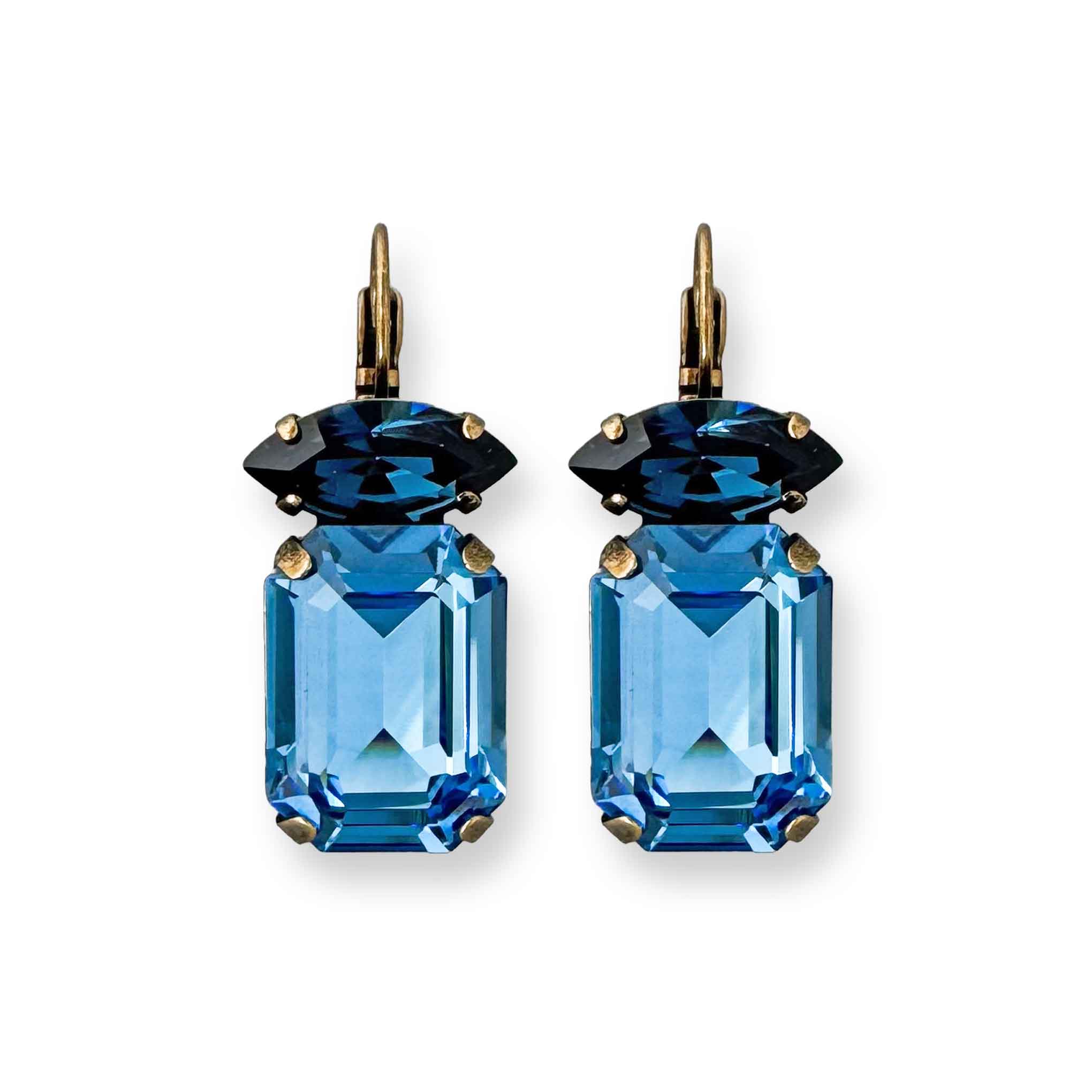 Emerald and marquise cut blue crystal drop earrings shown in antique brass.