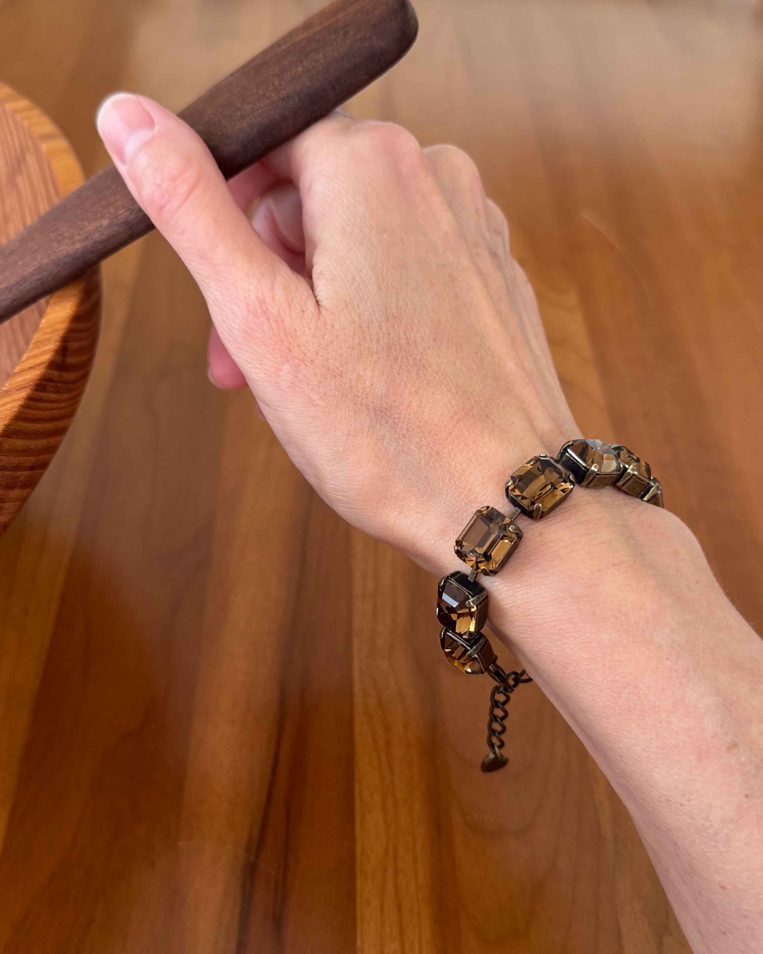 Brown crystal bracelet by Petite Margaux shown on wrist.