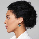 Woman wearing brown and black crystal rhinestone statement earrings by Petite Margaux.