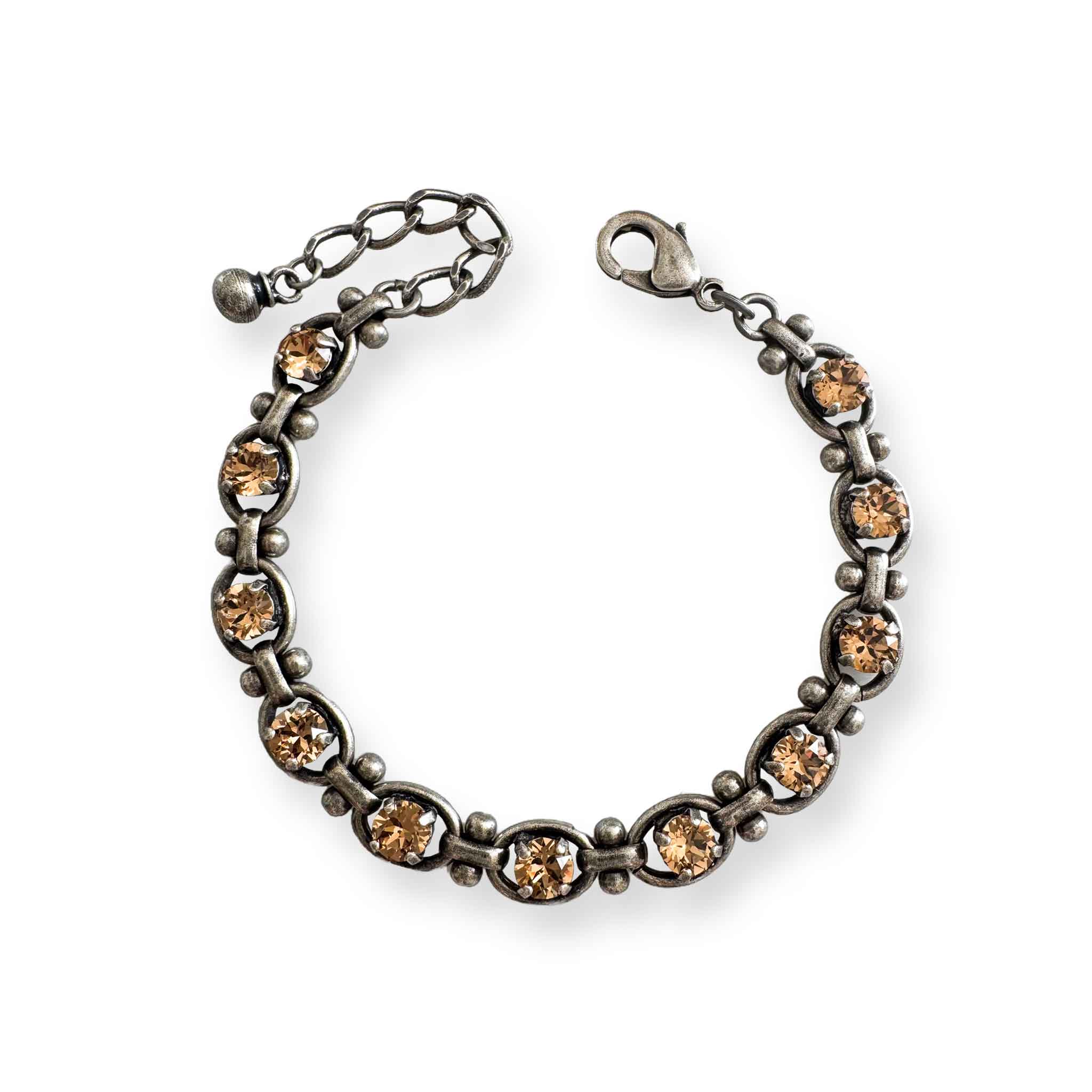 Antique silver link bracelet with light golden topaz crystals.