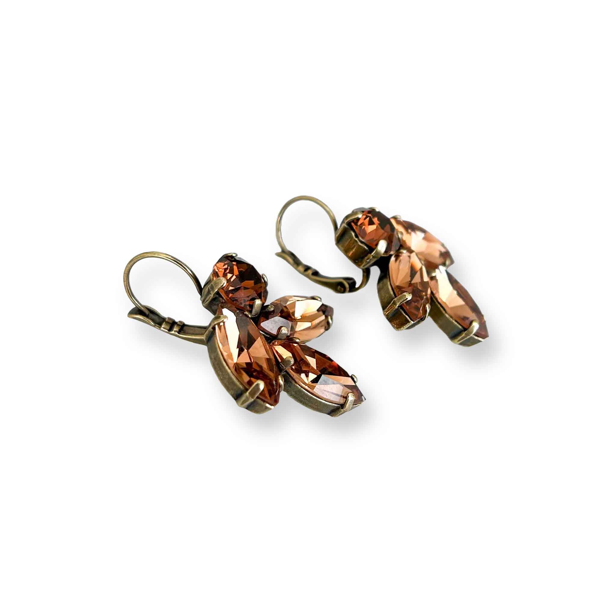 Side view of antique brass and gorgeous brown topaz colored crystal earrings.
