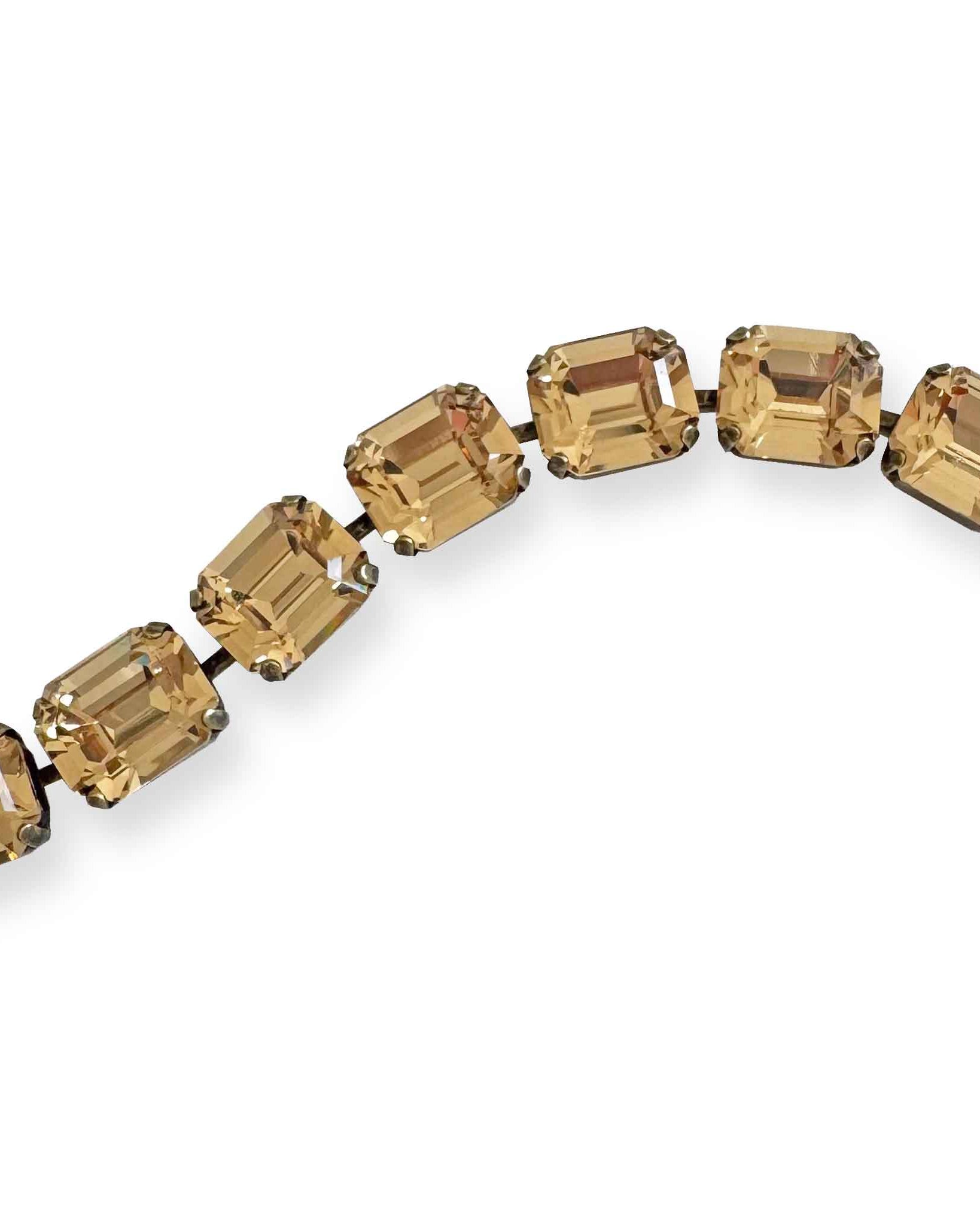 Close up of warm golden topaz crystal bracelet - emerald cut.