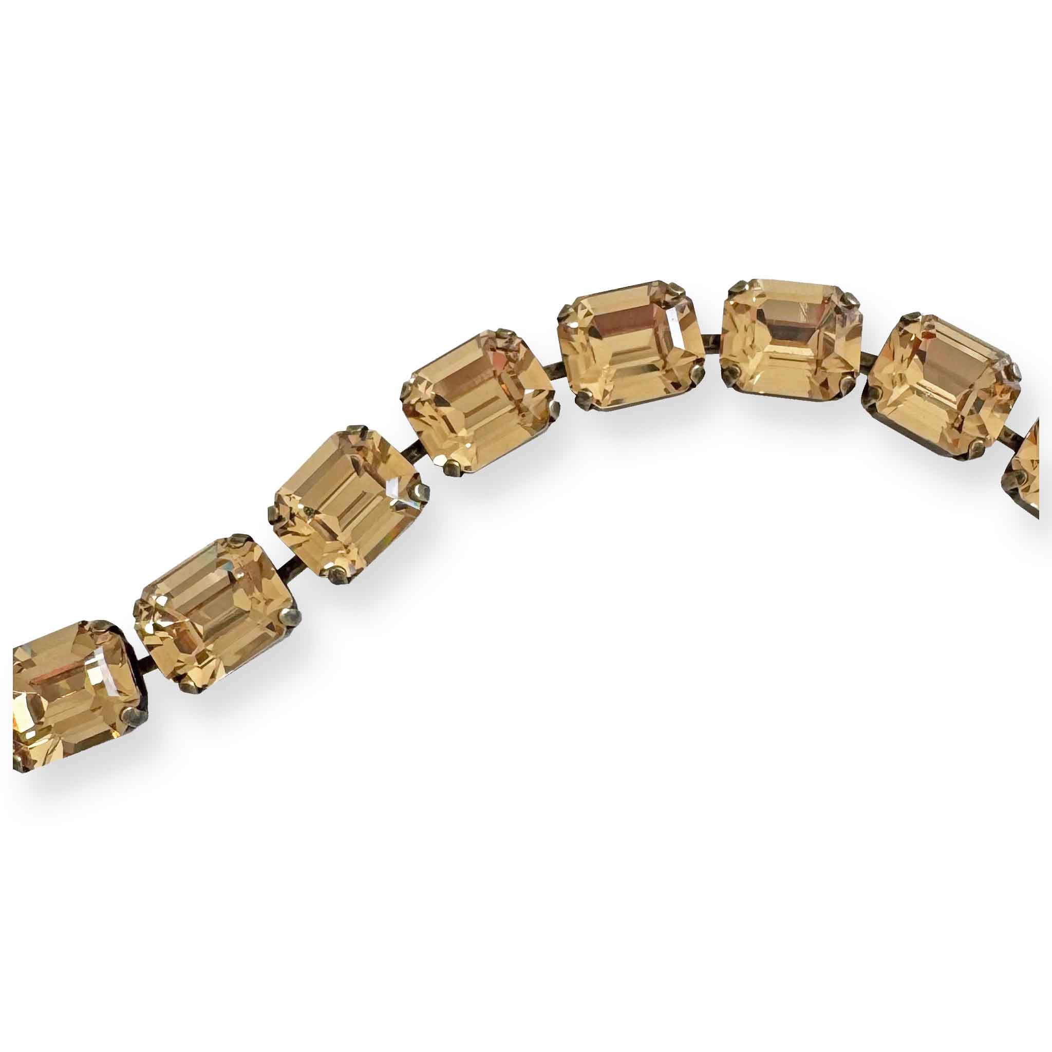 Close up of warm golden topaz crystal bracelet - emerald cut.