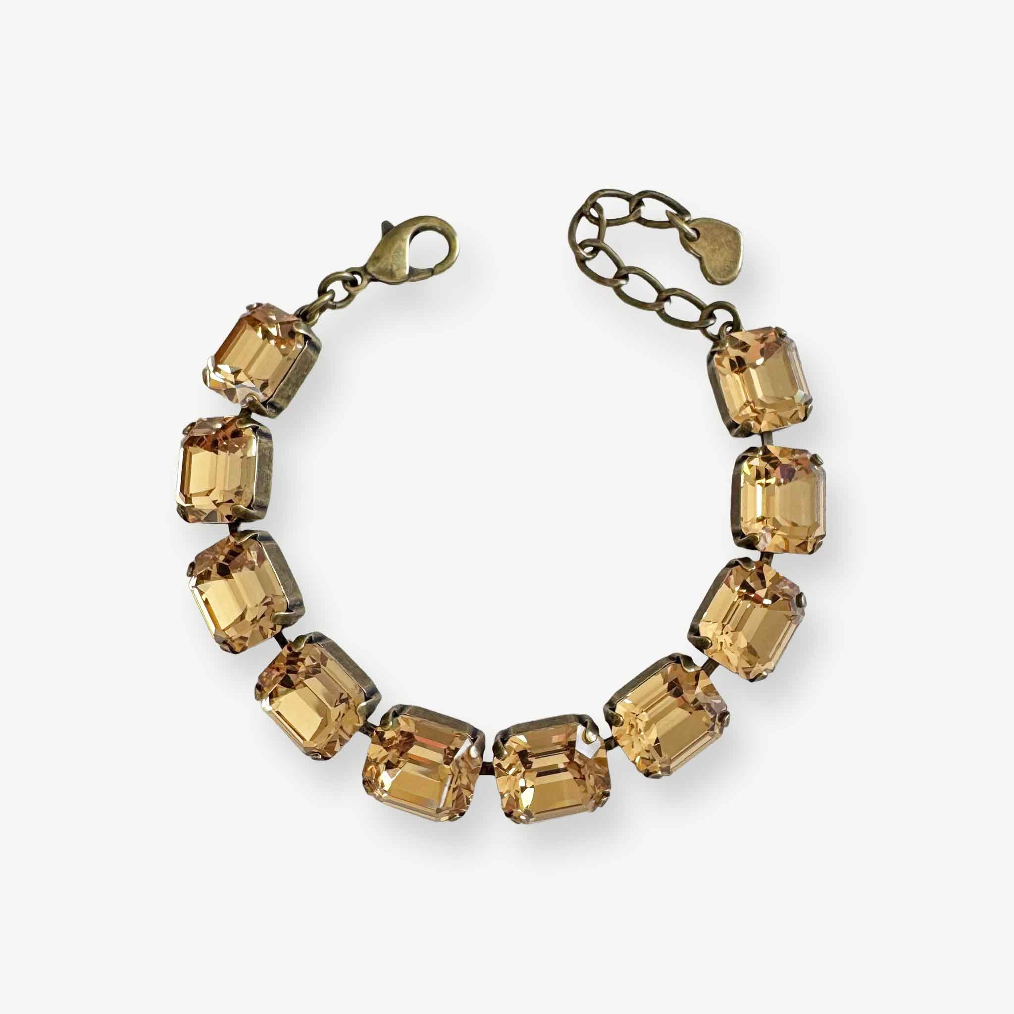 Emerald-cut crystal bracelet in warm, light Colorado topaz color set in antique brass. Adjustable.