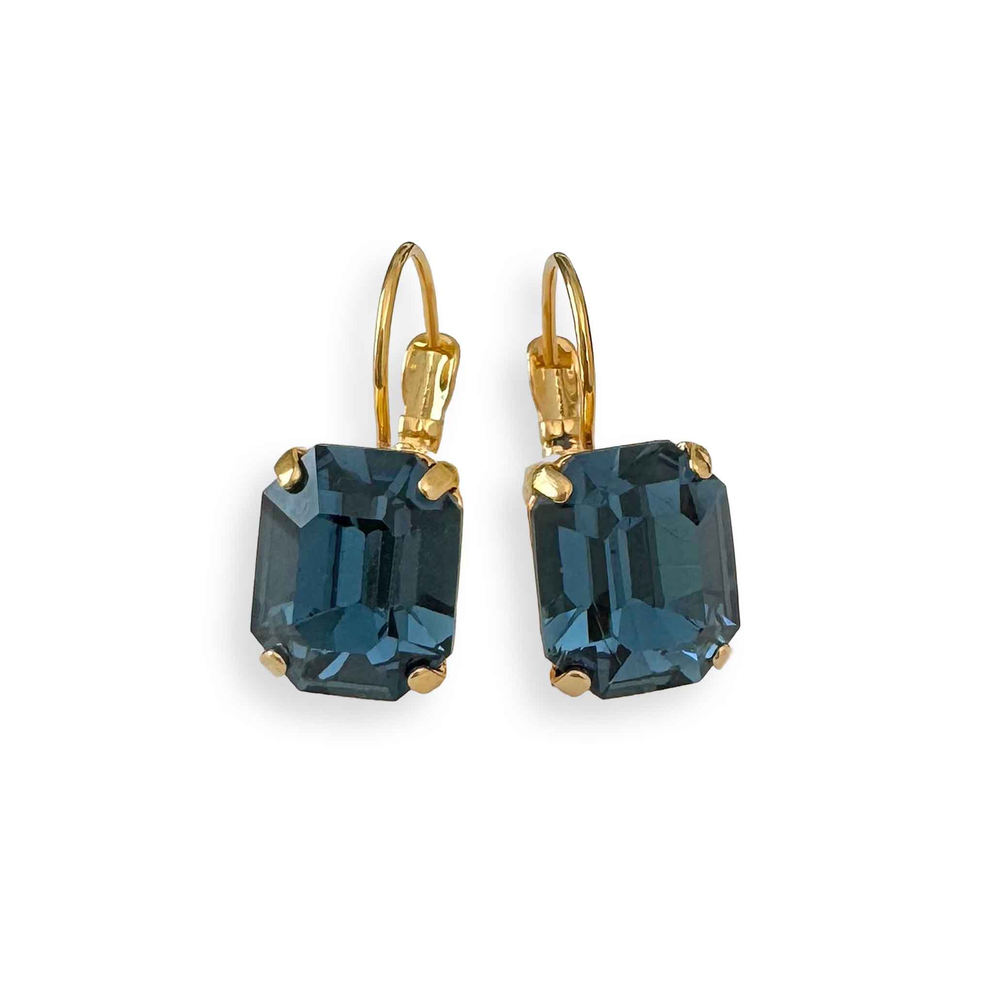 Deep blue crystal earrings shown with gold leverback hooks.