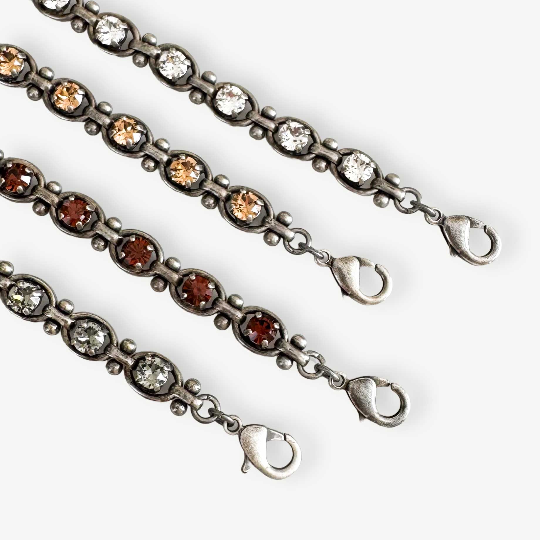 Closeup of the Octavia link tennis bracelet shown in more colors.