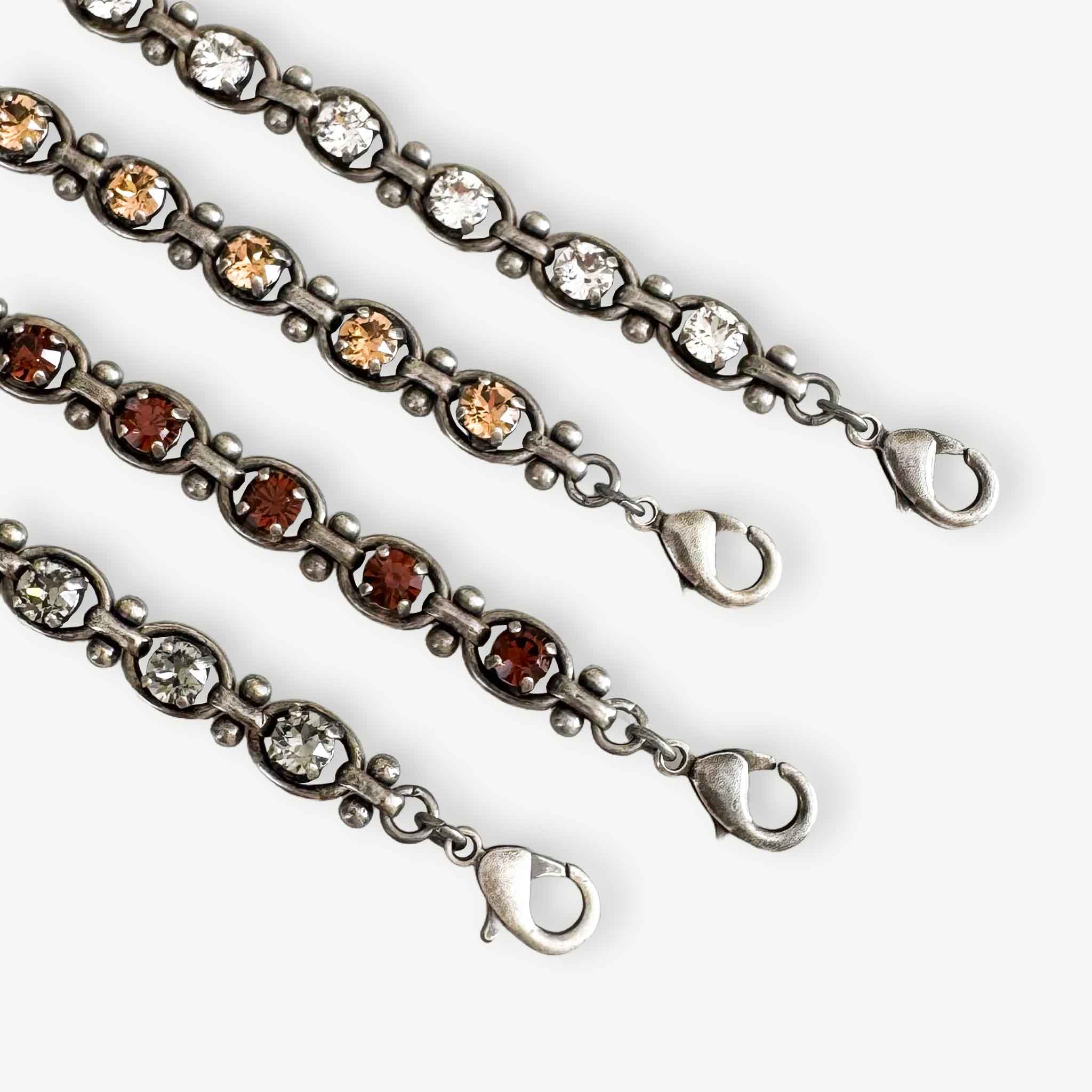 Closeup of the Octavia link tennis bracelet shown in more colors.