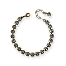 Black diamond color crystal tennis style bracelet shown in antique brass.