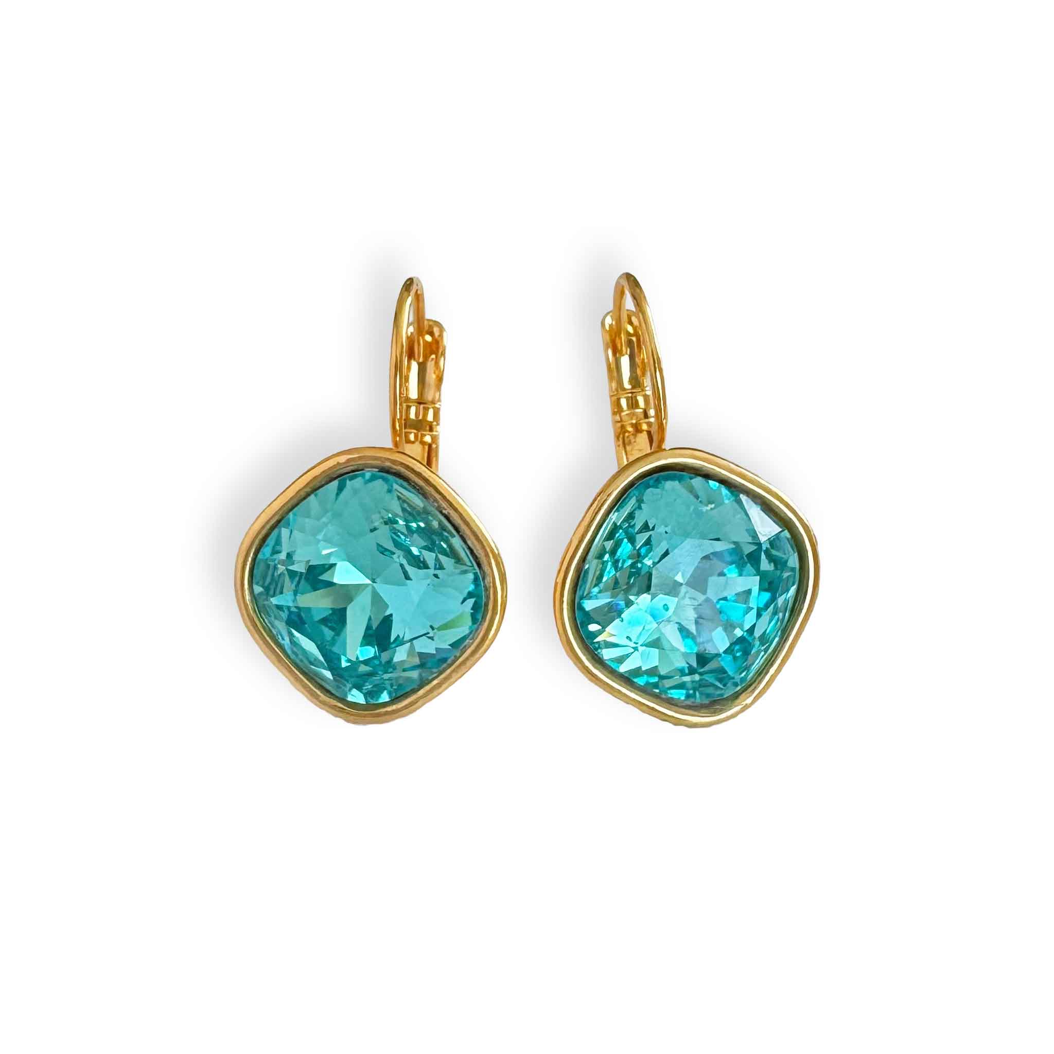 Shimmering aqua colored crystal earrings set in warm yellow gold leverbacks.