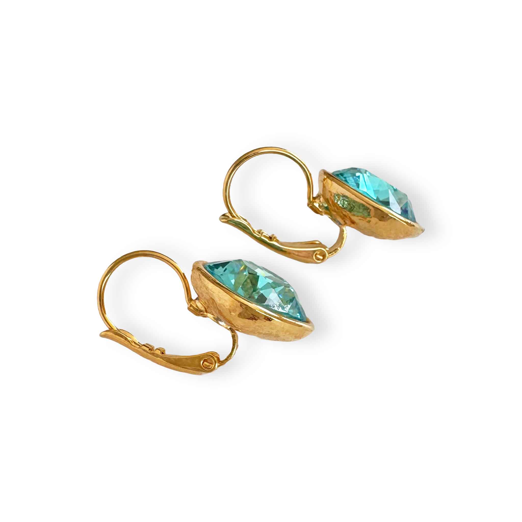 Side view of gold and turquoise earrings.