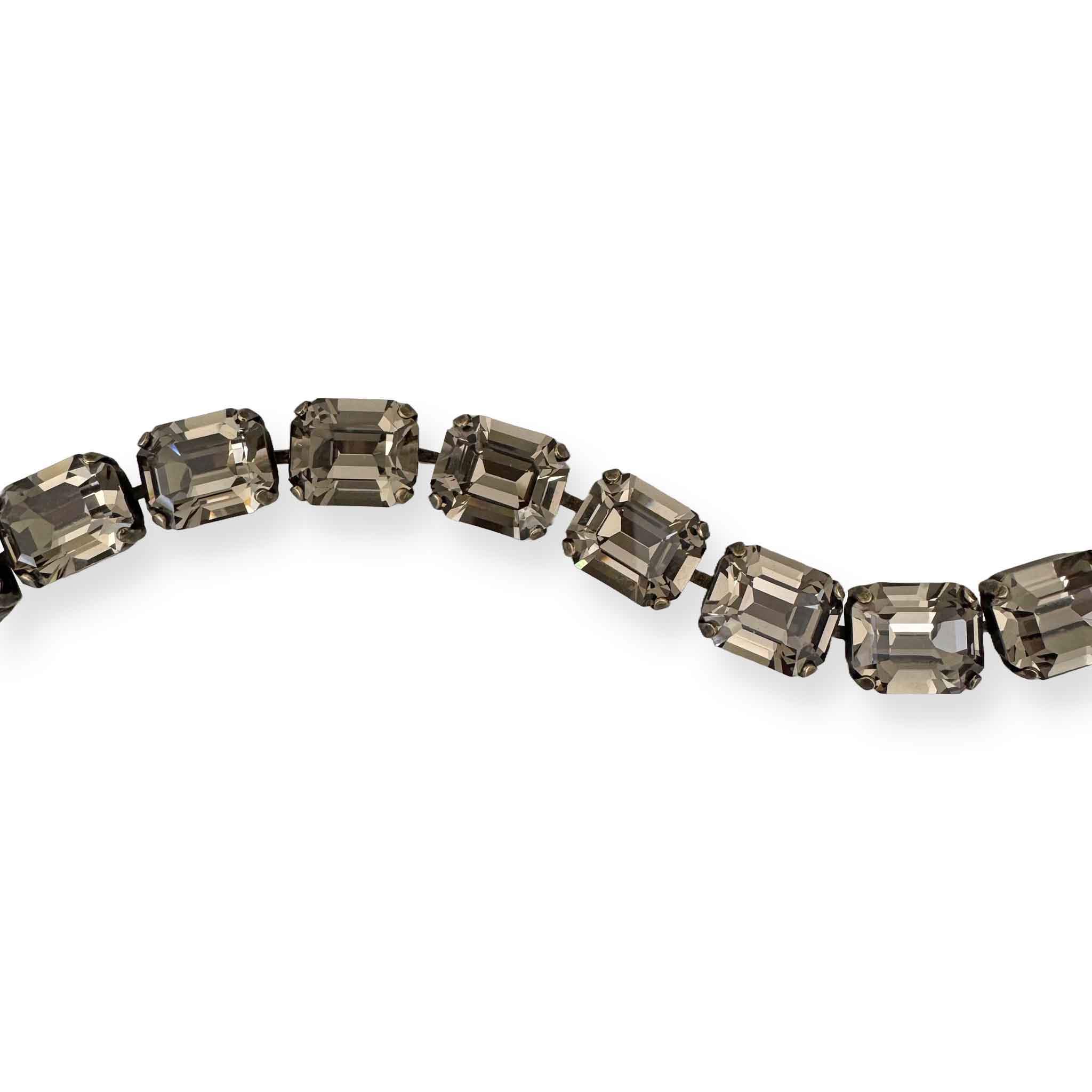 Close up of black diamond crystals in bracelet.