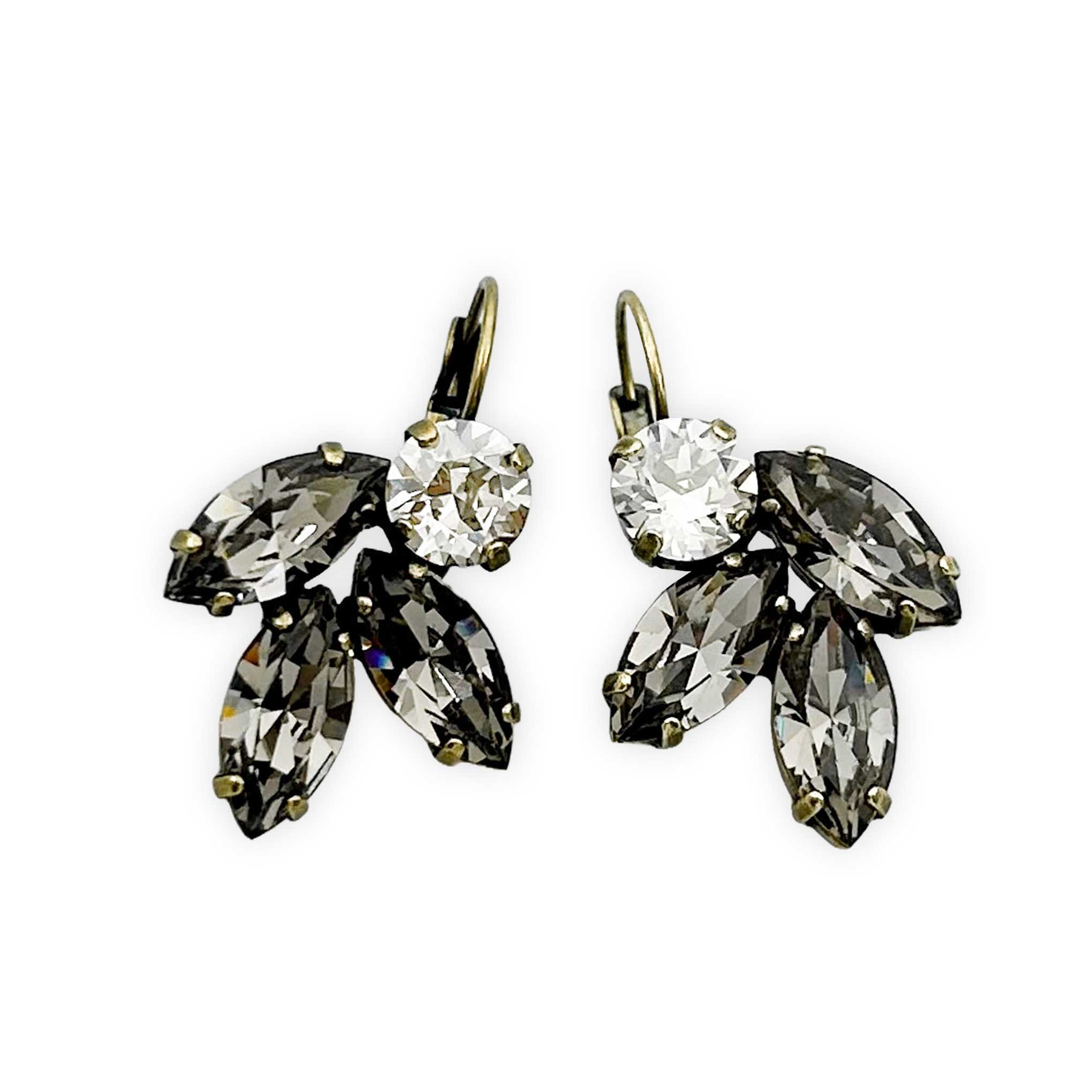 Clear and black crystal earrings. Stone shape is marquise and round. Metal finish is antique brass.