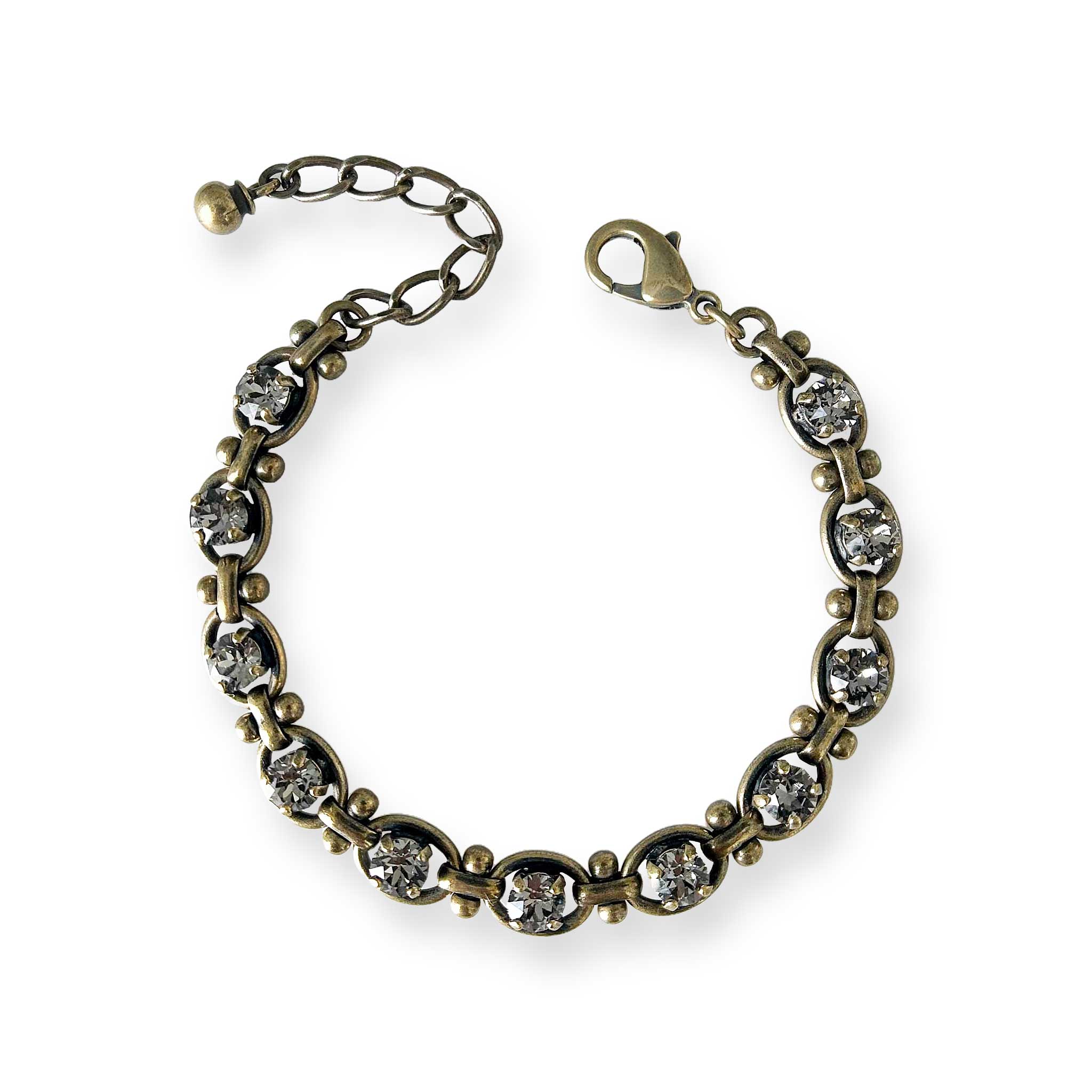 Adjustable black diamond rhinestone tennis bracelet  shown in antique brass.