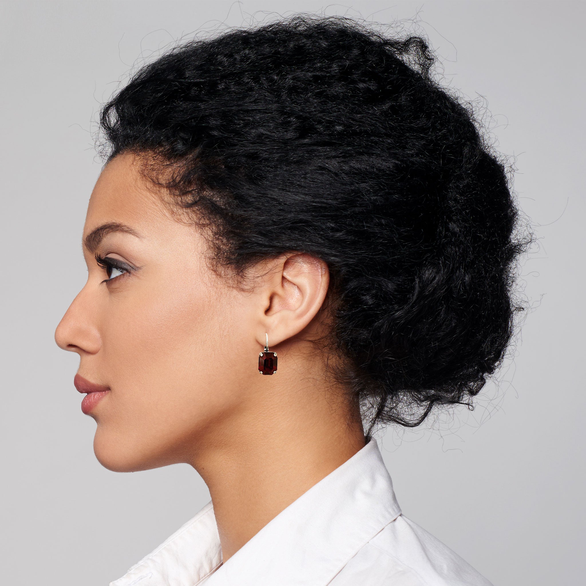 black women wearing garnet drop red earrings.