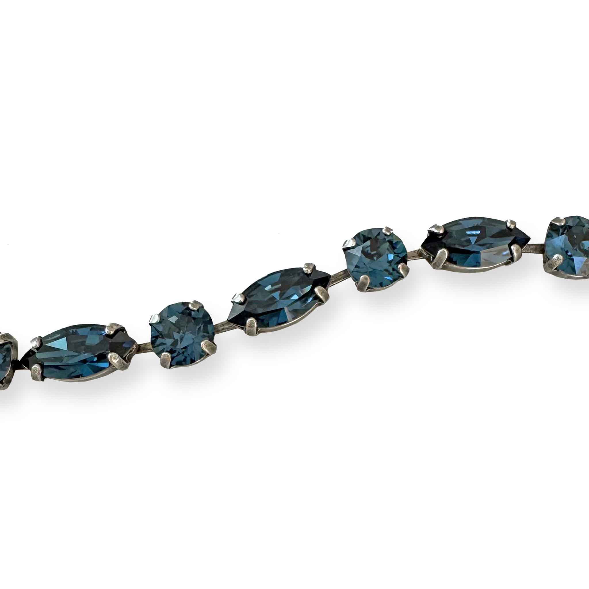close-up of blue cut crystal bracelet shown in antique silver.