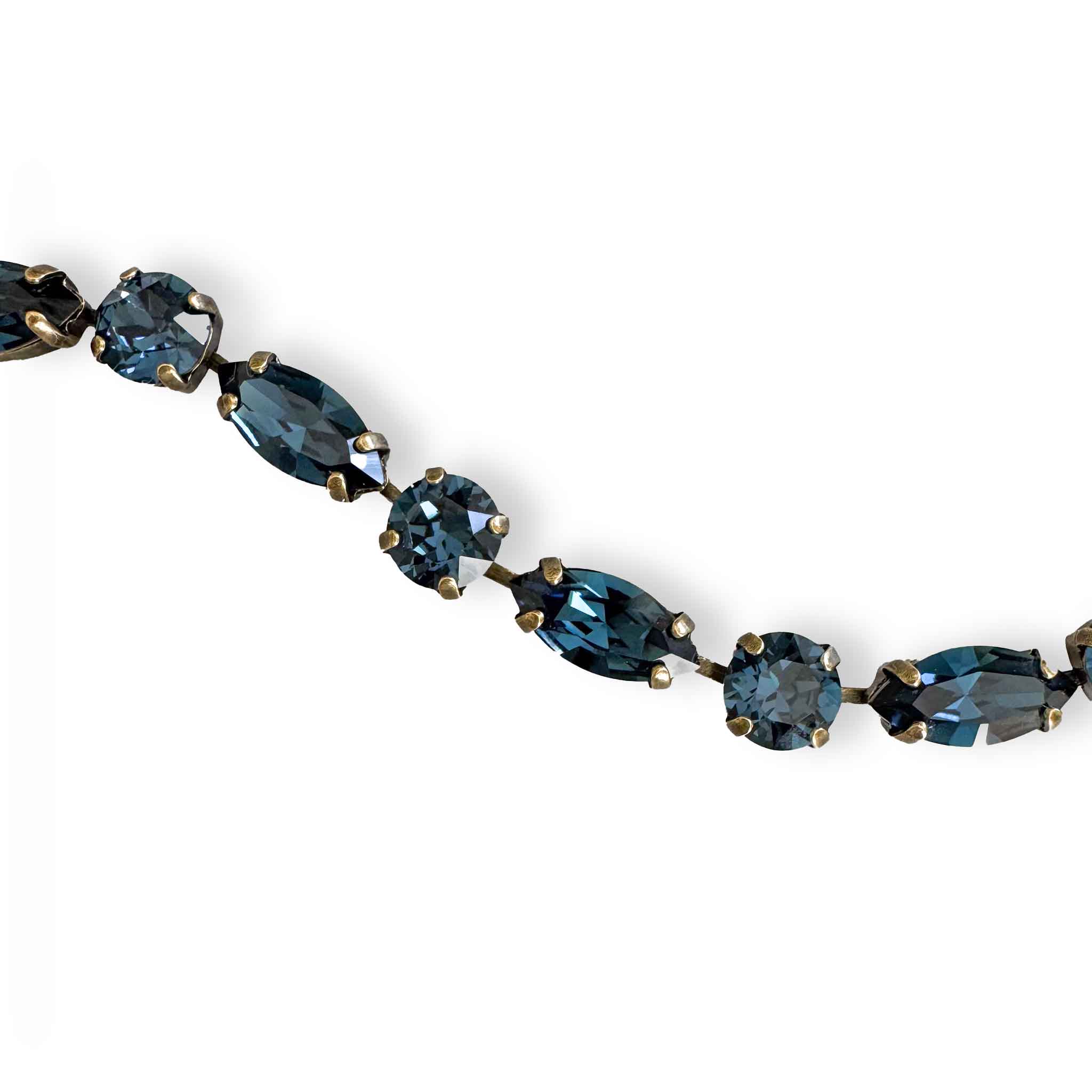 close-up of montana sapphire blue cut crystal bracelet shown in antique brass