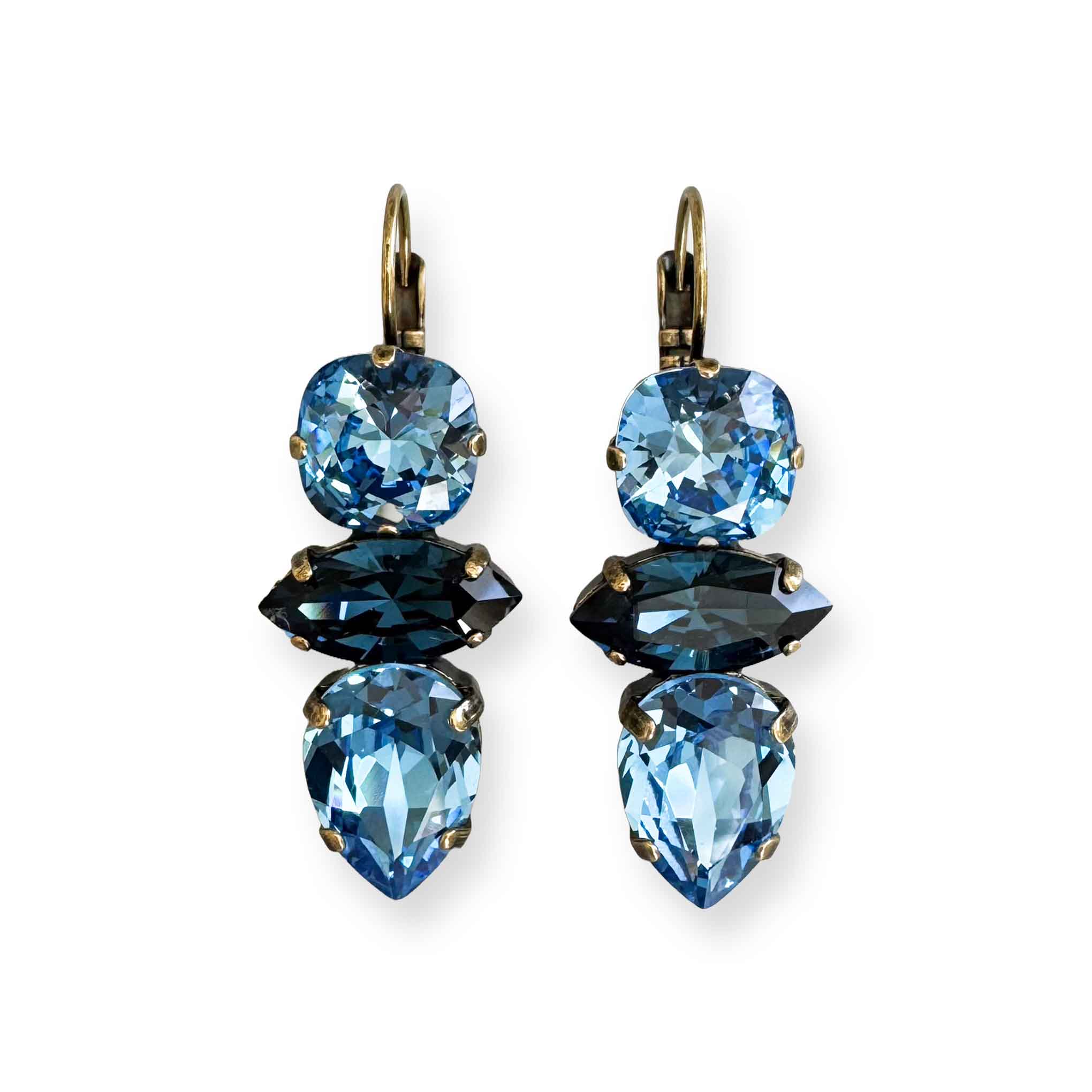 Blue jeweled earrings of cut crystal by Petite Margaux.