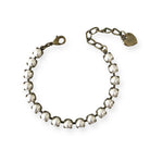 Adjustable pearl and antique brass bracelet.