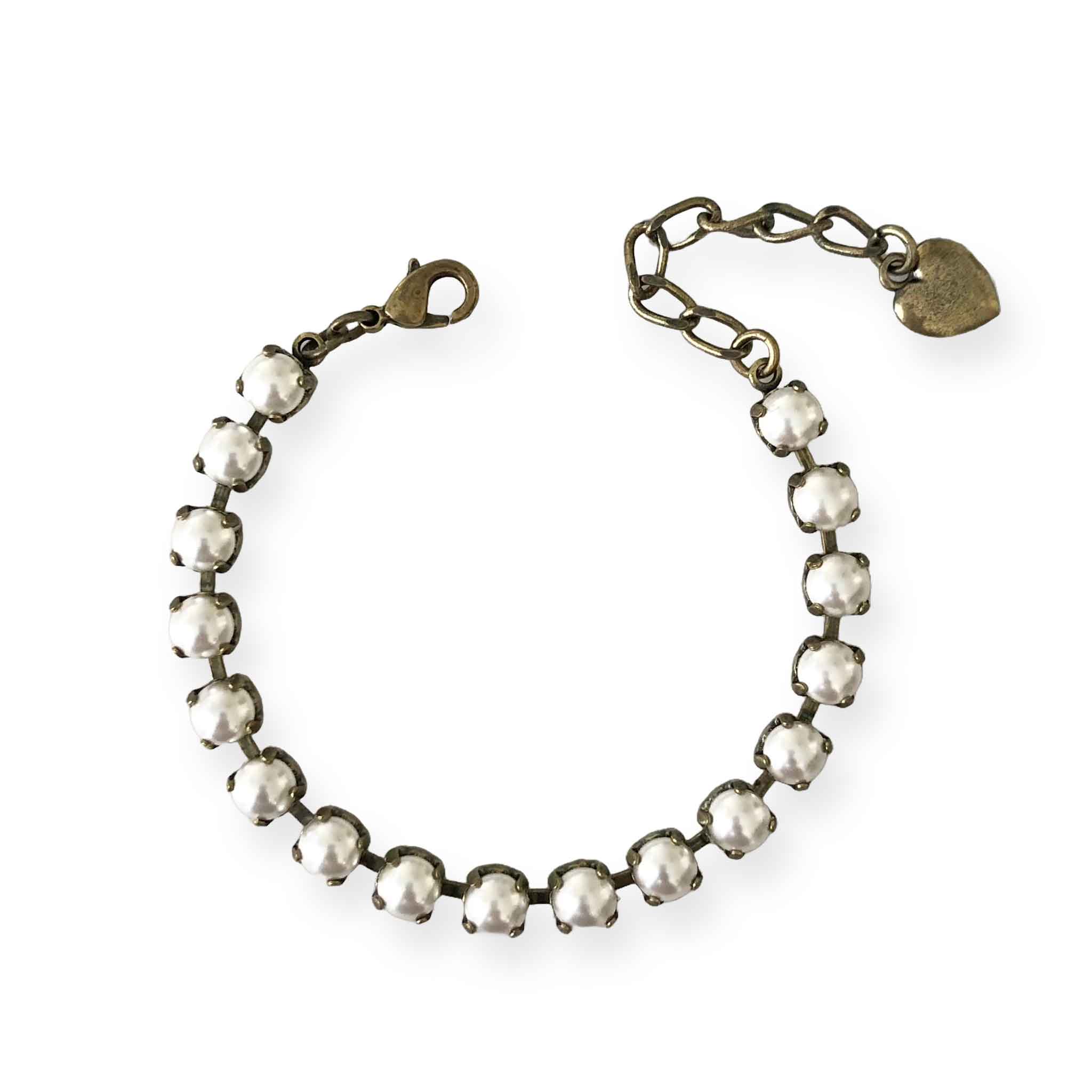 Adjustable pearl and antique brass bracelet.