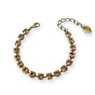 Smokey topaz crystal bracelet with adjustable extender and charm. Shown in antique brass.