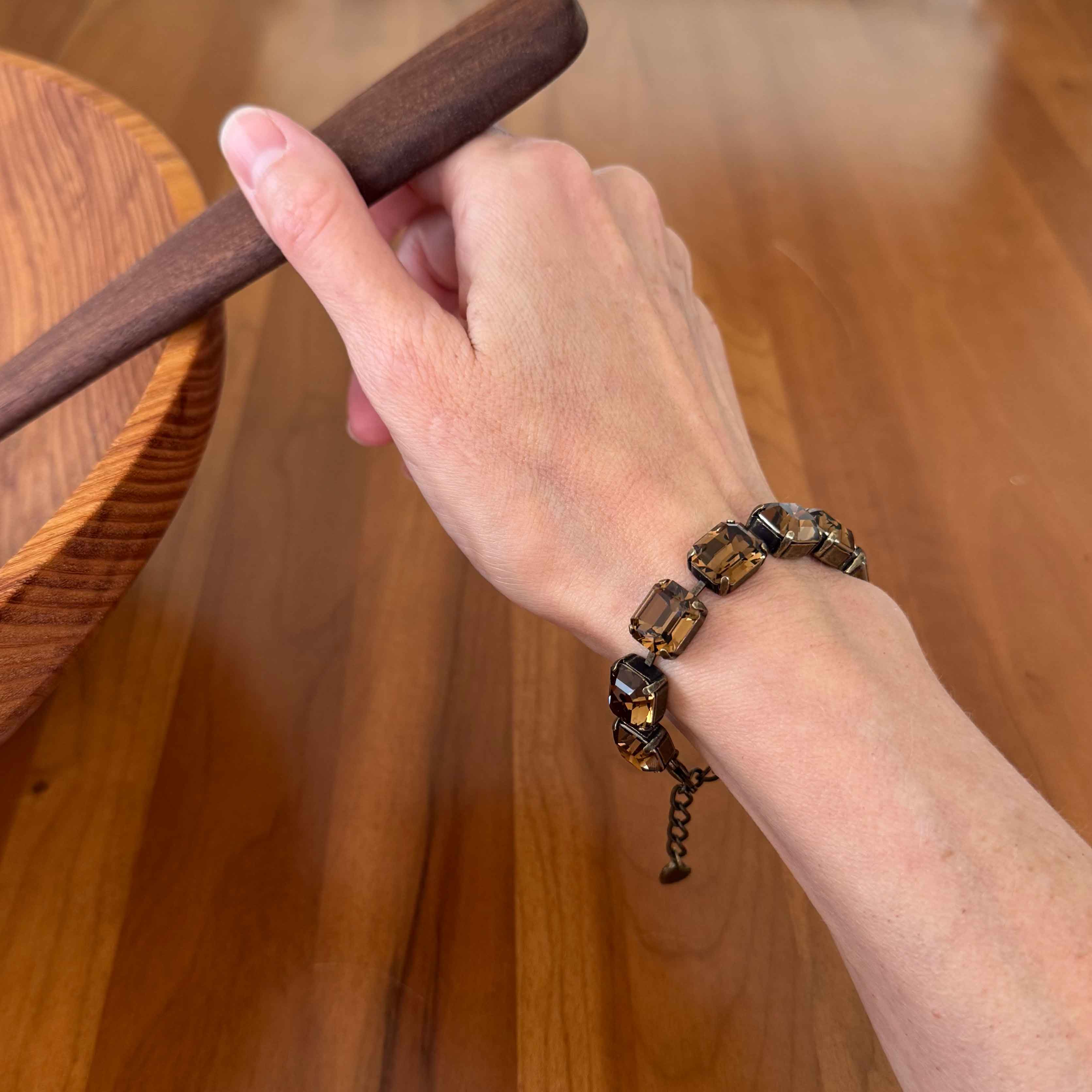 Brown crystal bracelet by Petite Margaux shown on wrist.