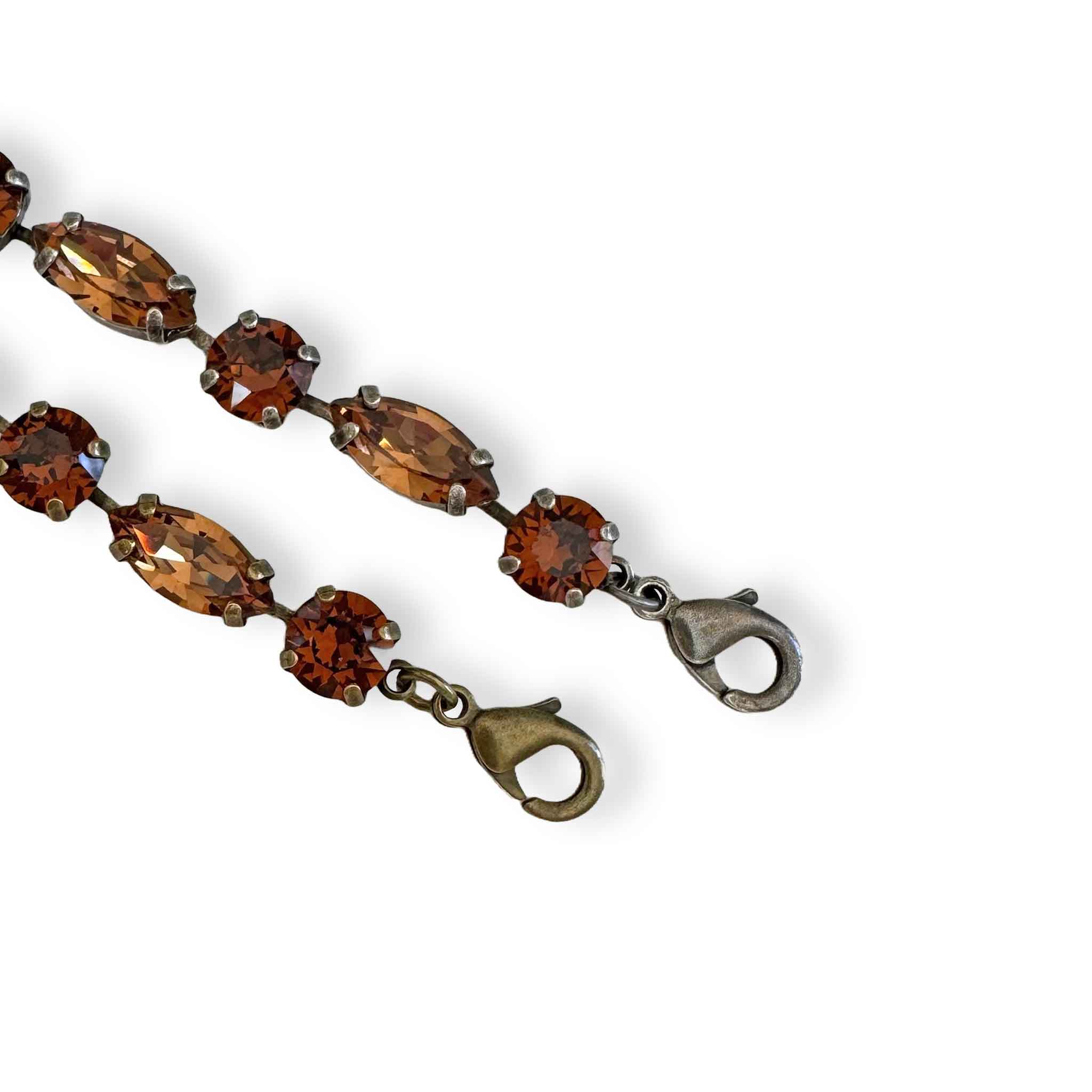 brown crystal bracelet by Petite Margaux shown in both antique brass and antique silver.