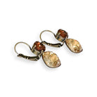 Side view of brown and yellow rhinestone crystal earrings.