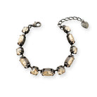 Champagne-colored golden shadow crystal bracelet shown in antique silver.