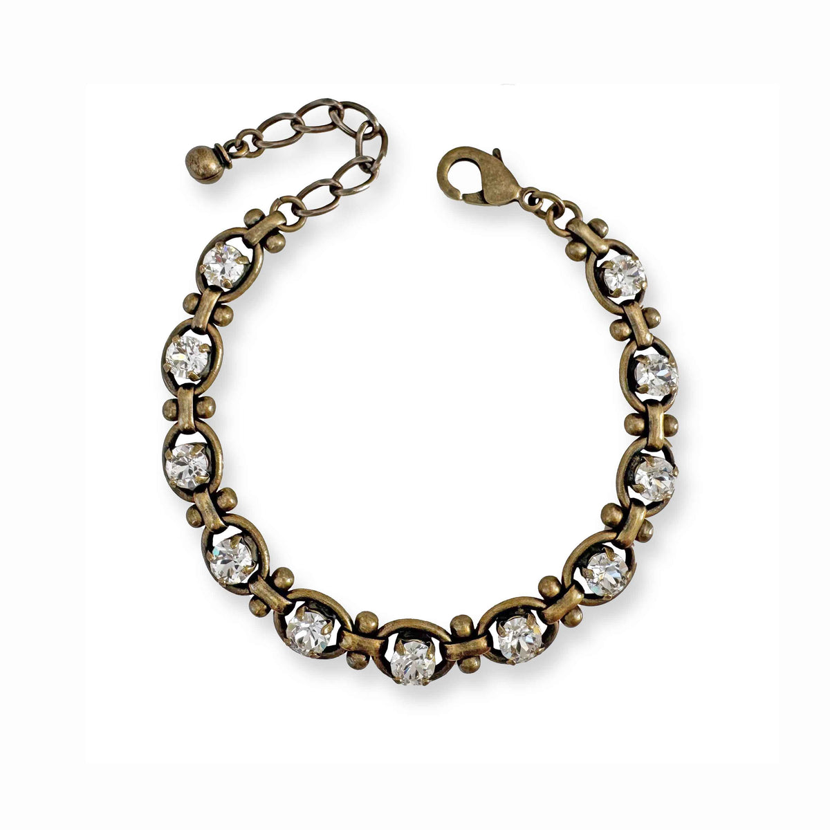 Clear crystal and antique brass link bracelet on white background.