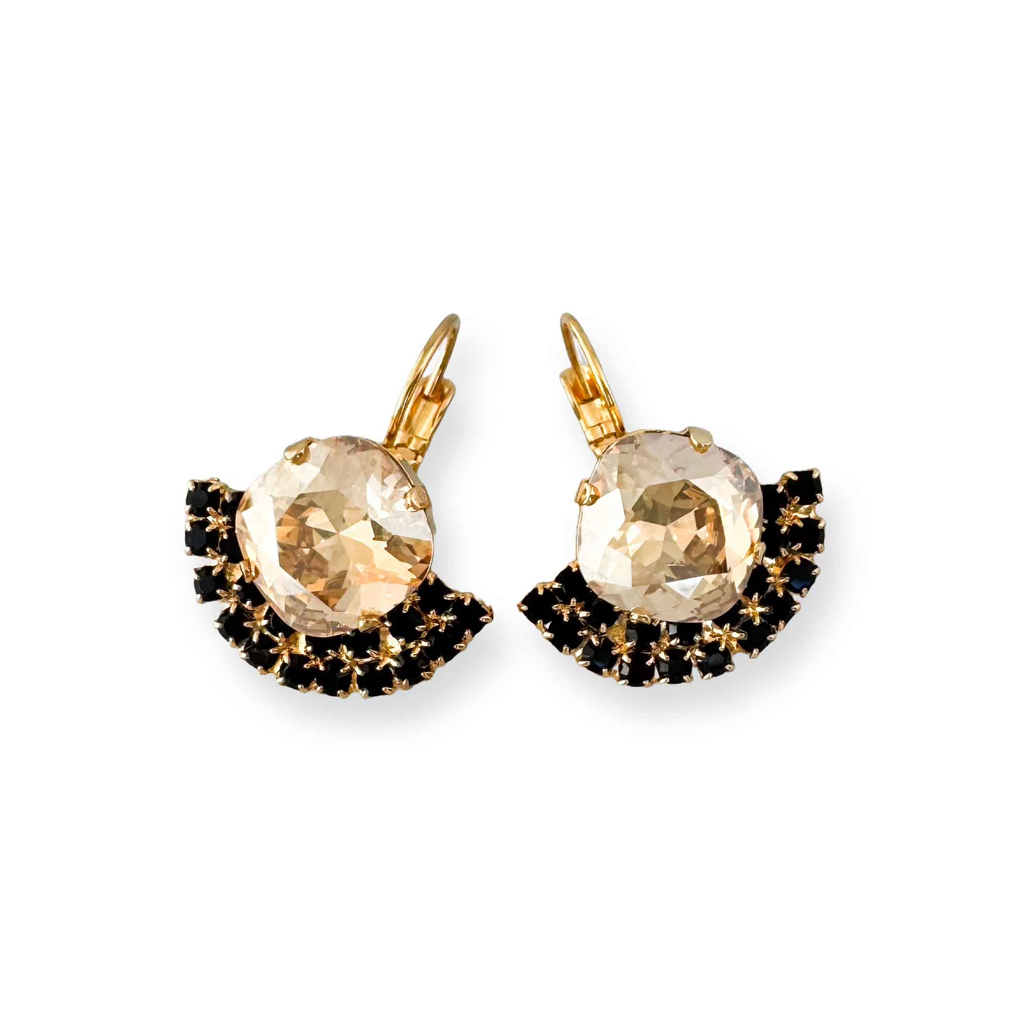 Fan-shaped crystal drop earrings with gold champagne-colored primary crystal and black accent crystal.