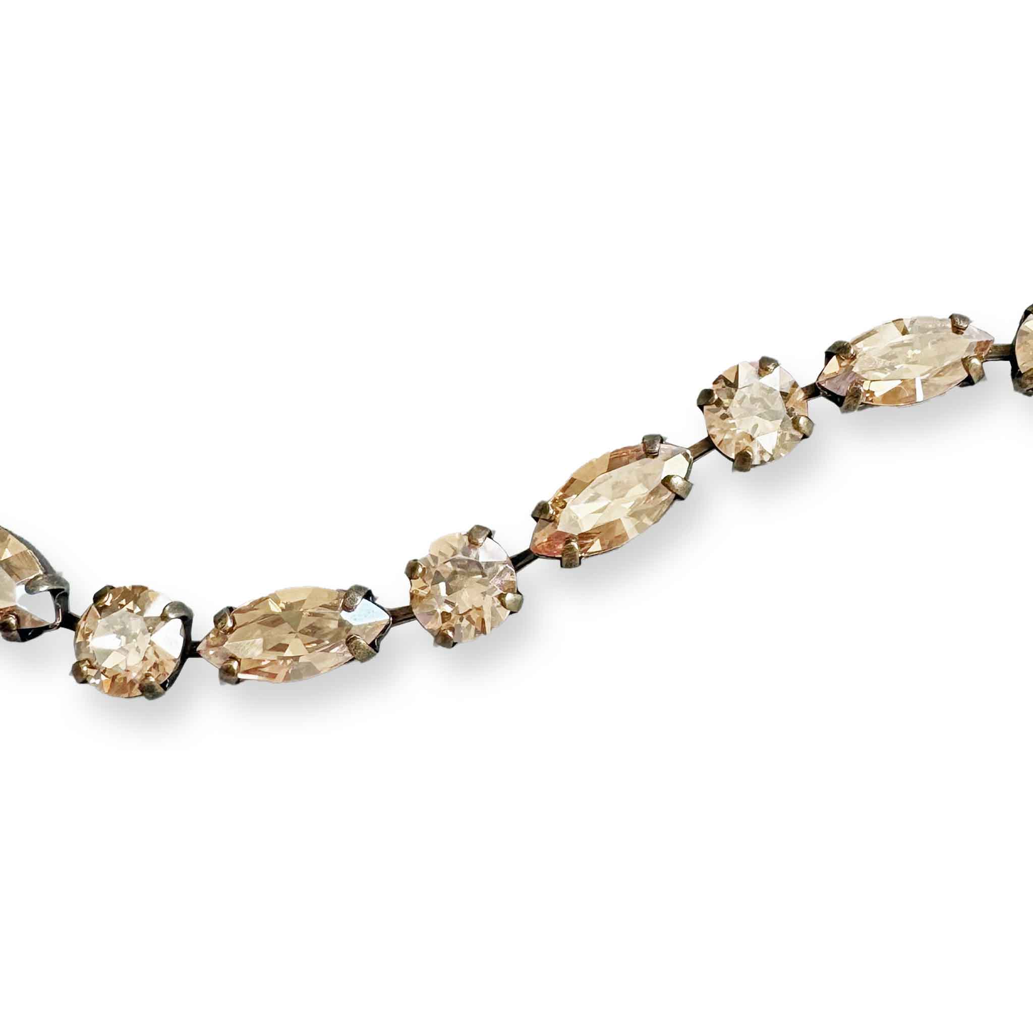 close up of golden shadow crystal bracelet by Petite Margaux.