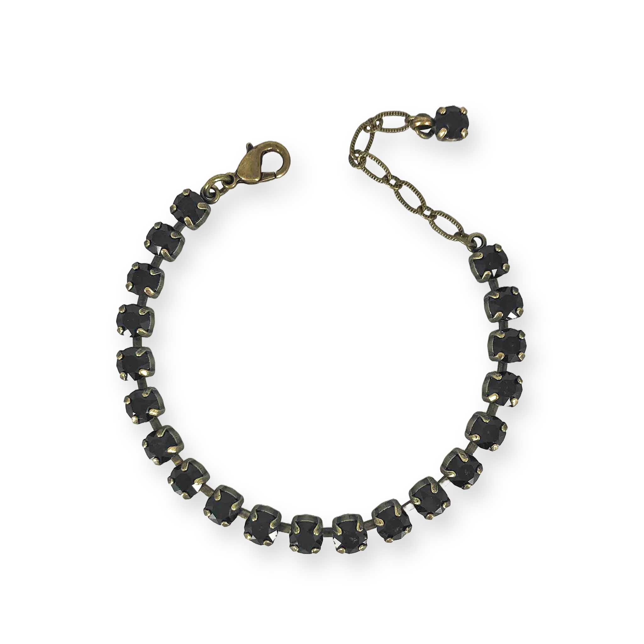 Brass and black stone tennis style bracelet.