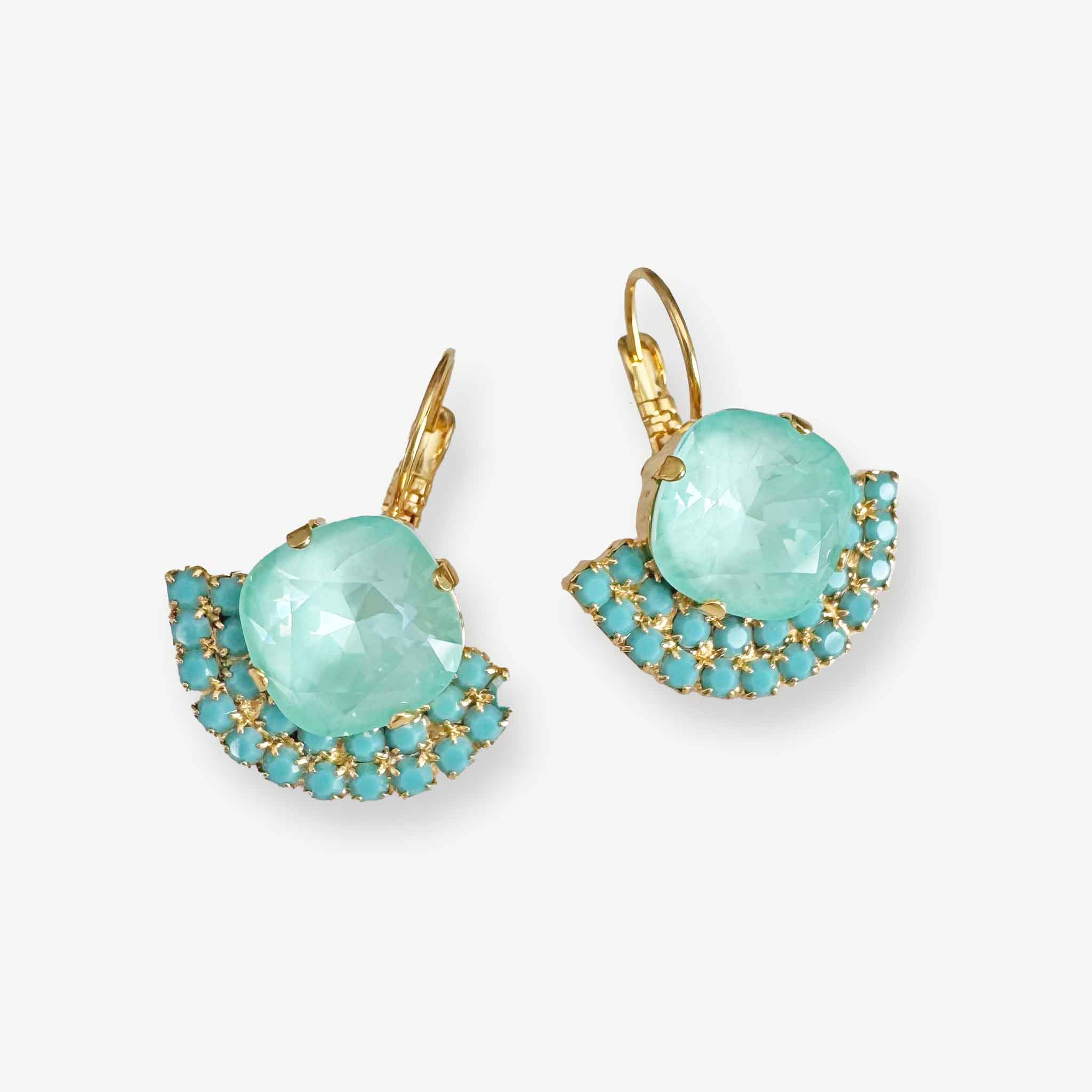 Light turquoise and mint green crystal drop earrings in a fan shape with a yellow gold setting and leverback closure.
