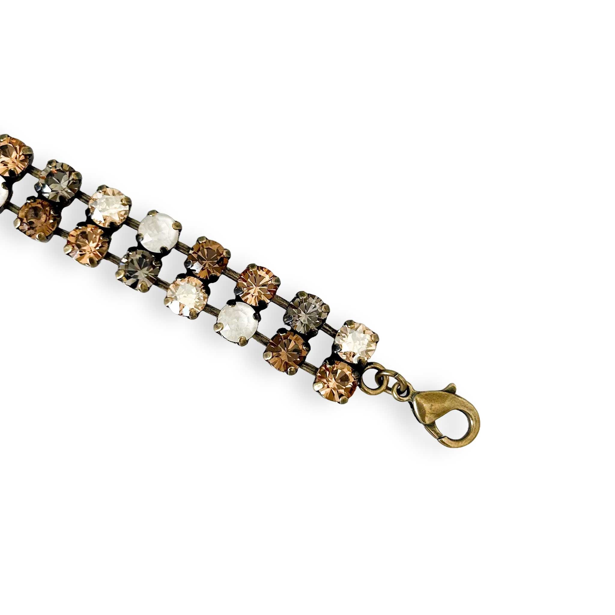 Close up of brown, black and white stone bracelet.