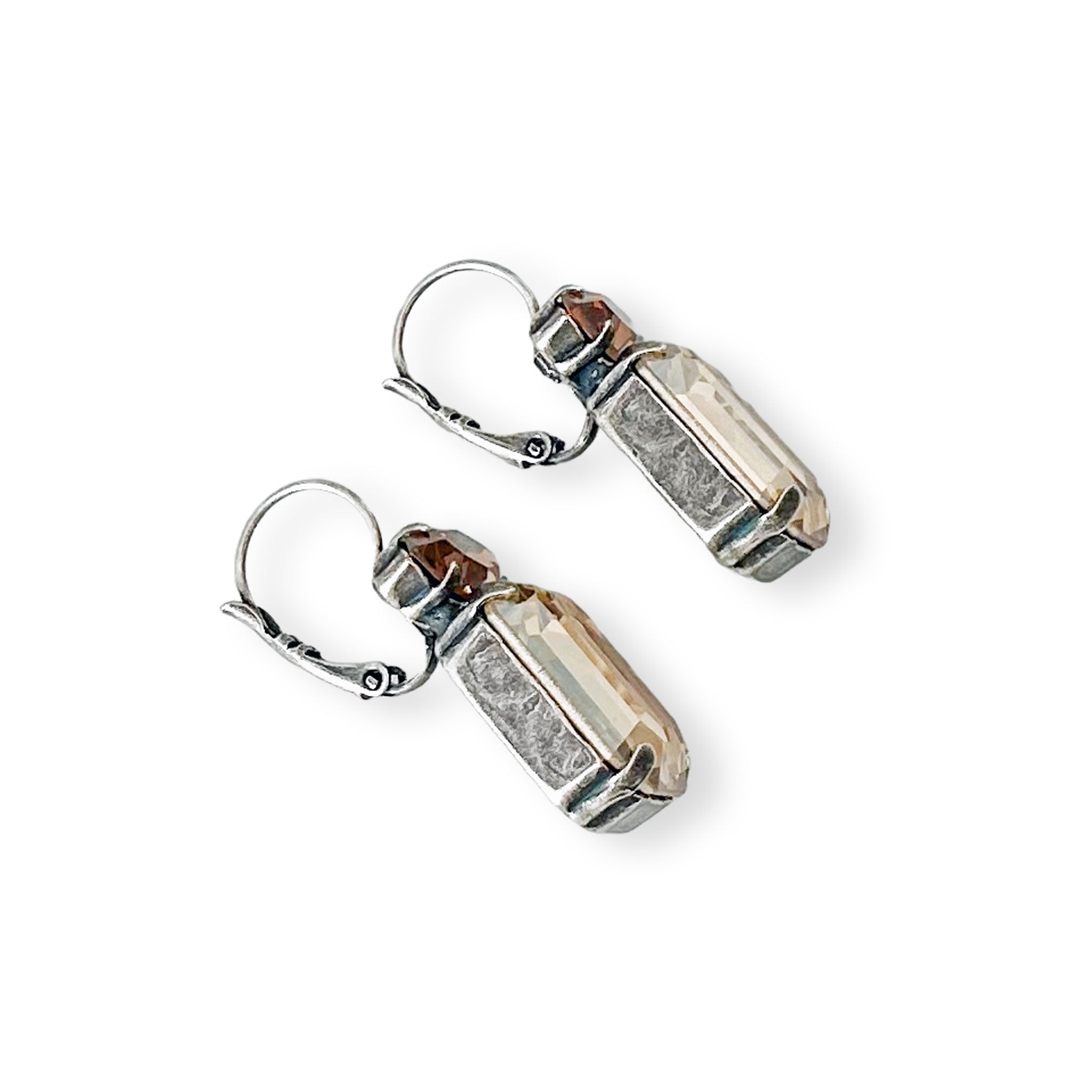 Side view of yellow and brown topaz earrings shown in antique silver.