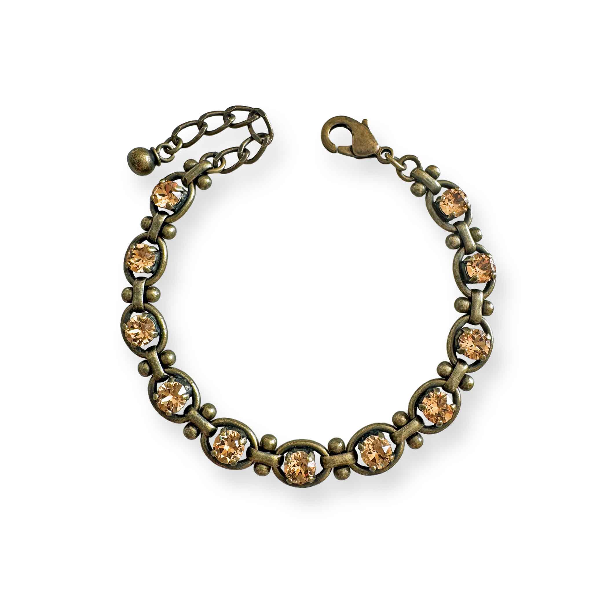 Brass tennis bracelet with golden topaz crystals.