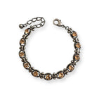 Antique silver link bracelet with light golden topaz crystals.