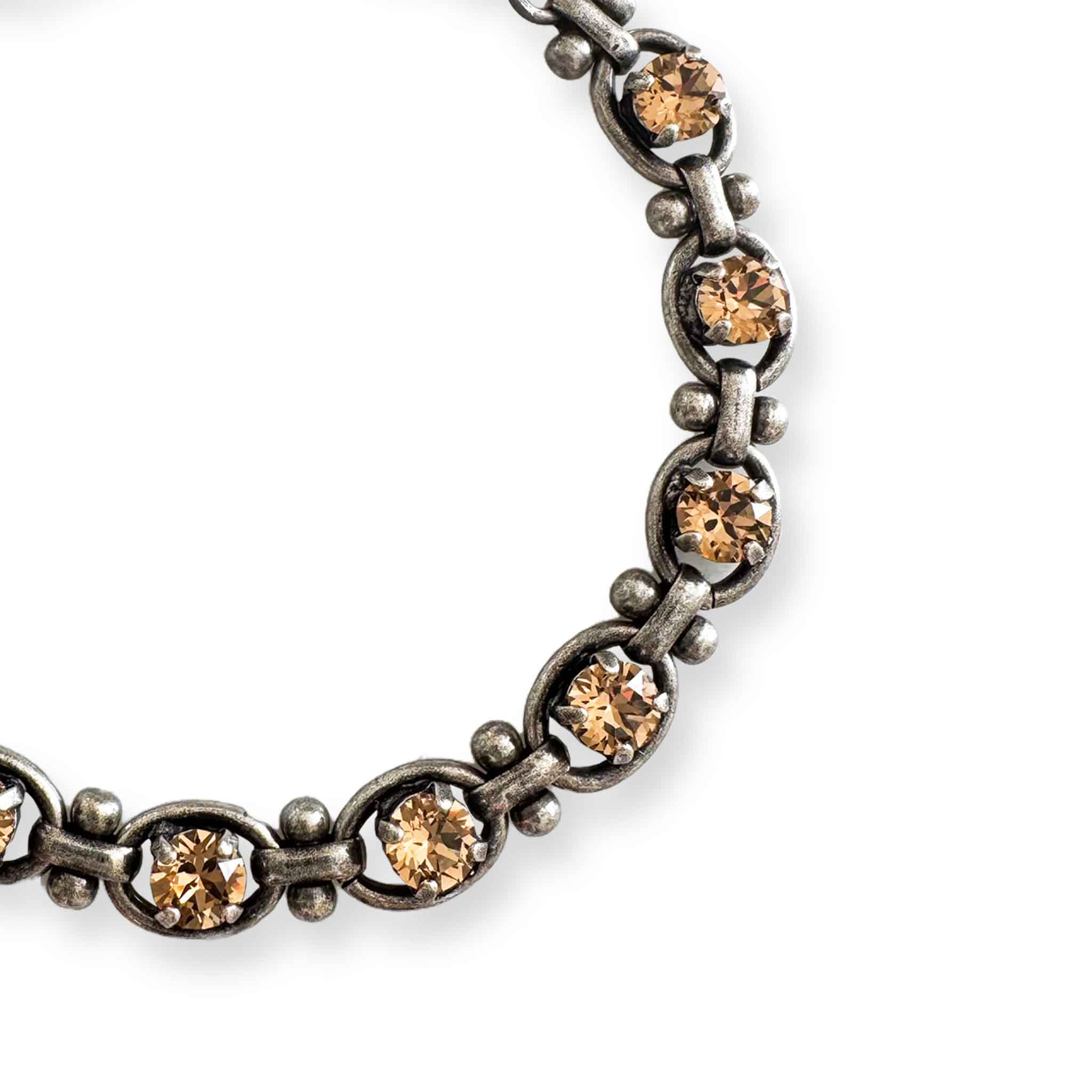 close up of silver and yellow topaz bracelet by Petite Margaux.