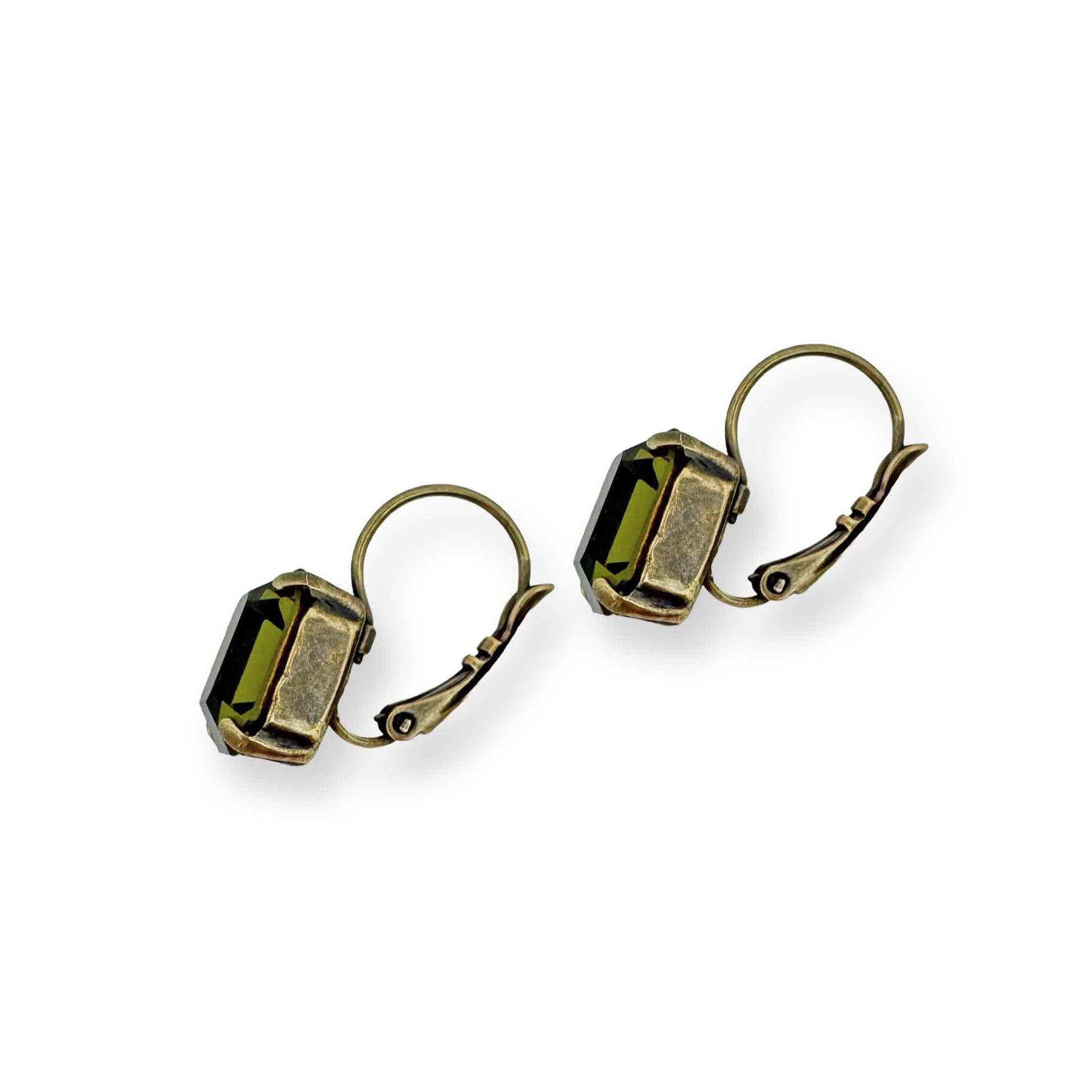 Side view of brass and olive green crystal drop earrings.