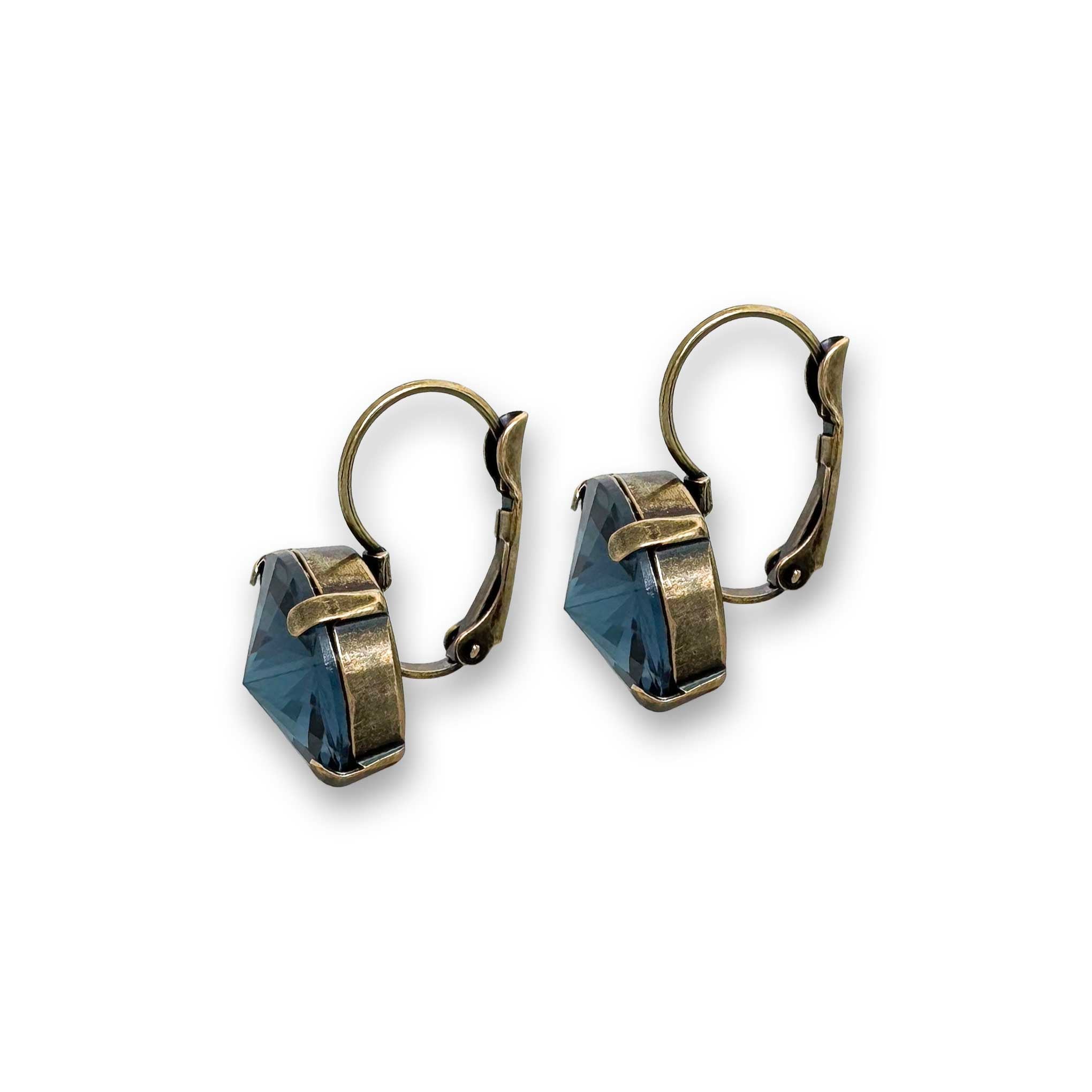 Side view of ocean blue rivoli drop earrings shown in antique brass.