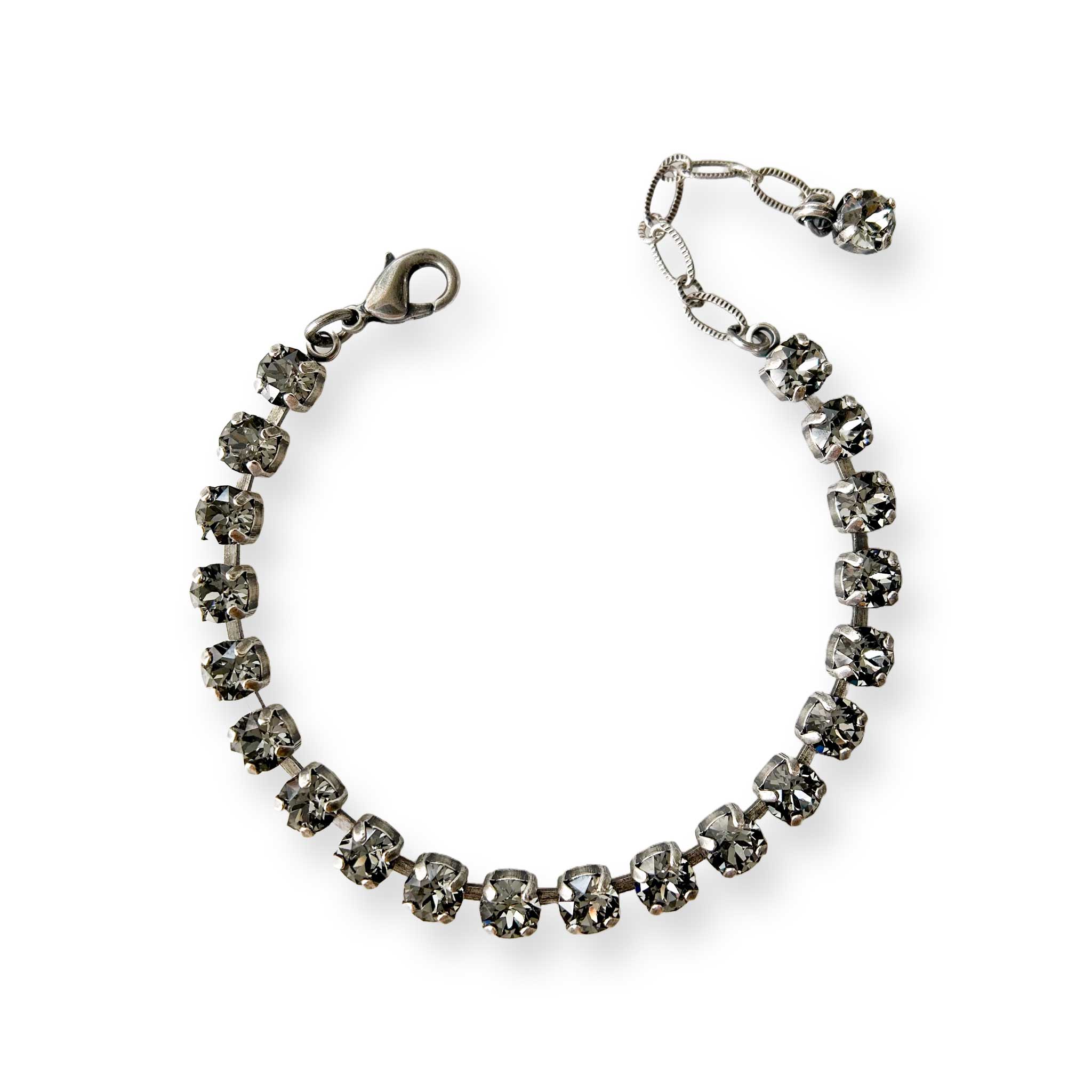 Adjustable, delicate black crystal bracelet shown in antique silver.