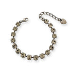 Adjustable black tennis bracelet of black diamond-colored crystals. Shown in antique silver.