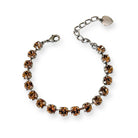 Smoked topaz Austrian crystal rhinestone bracelet with adjustable extender and charm. Shown in antique silver finish.