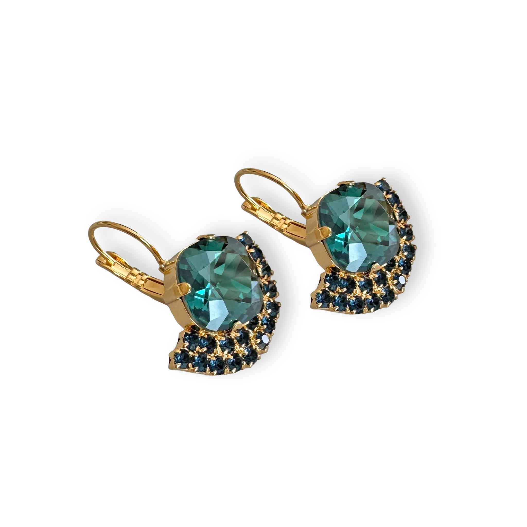 Side view of gold and teal crystal rhinestone earrings.