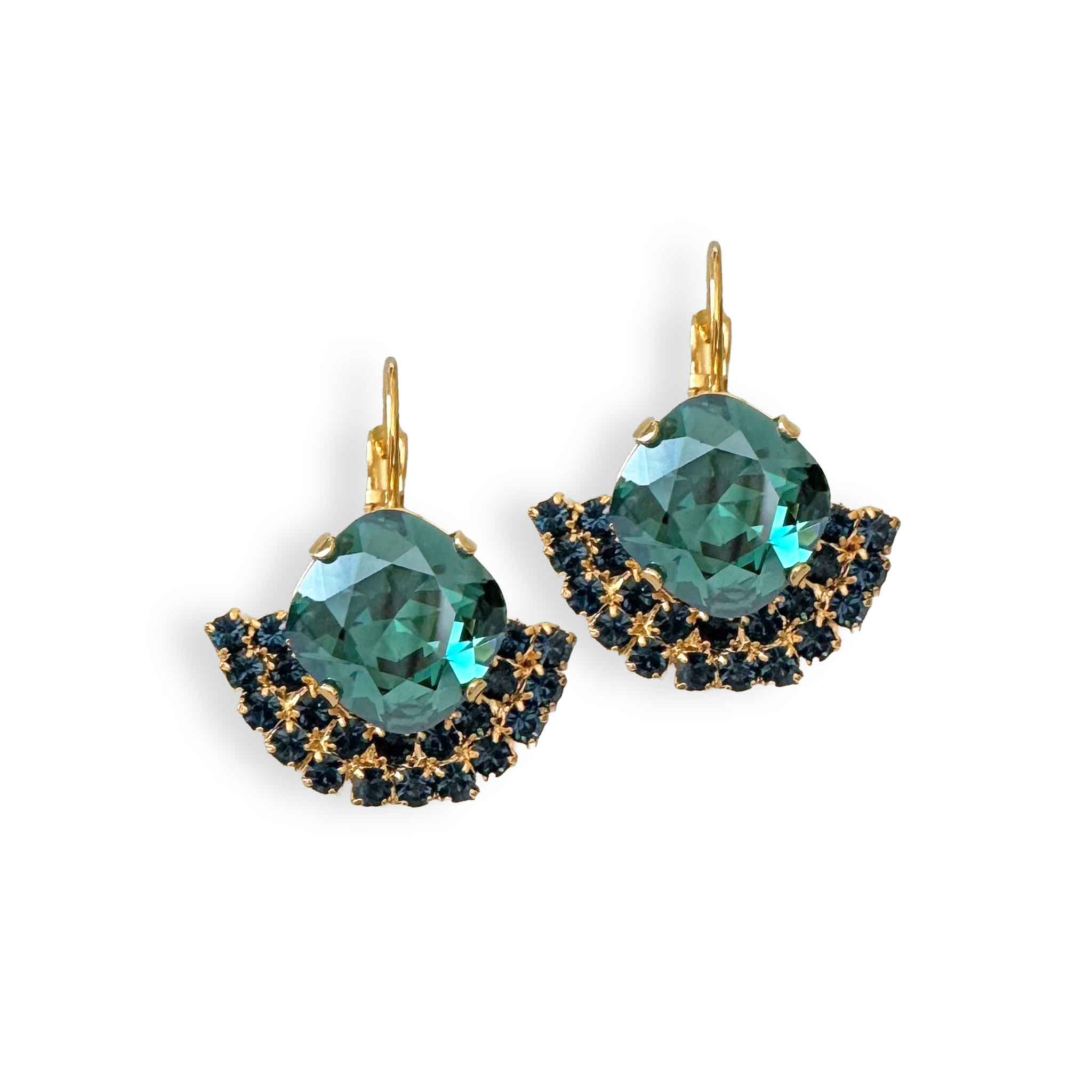 Front view of deep ocean teal and sapphire blue crystal party earrings in gold.