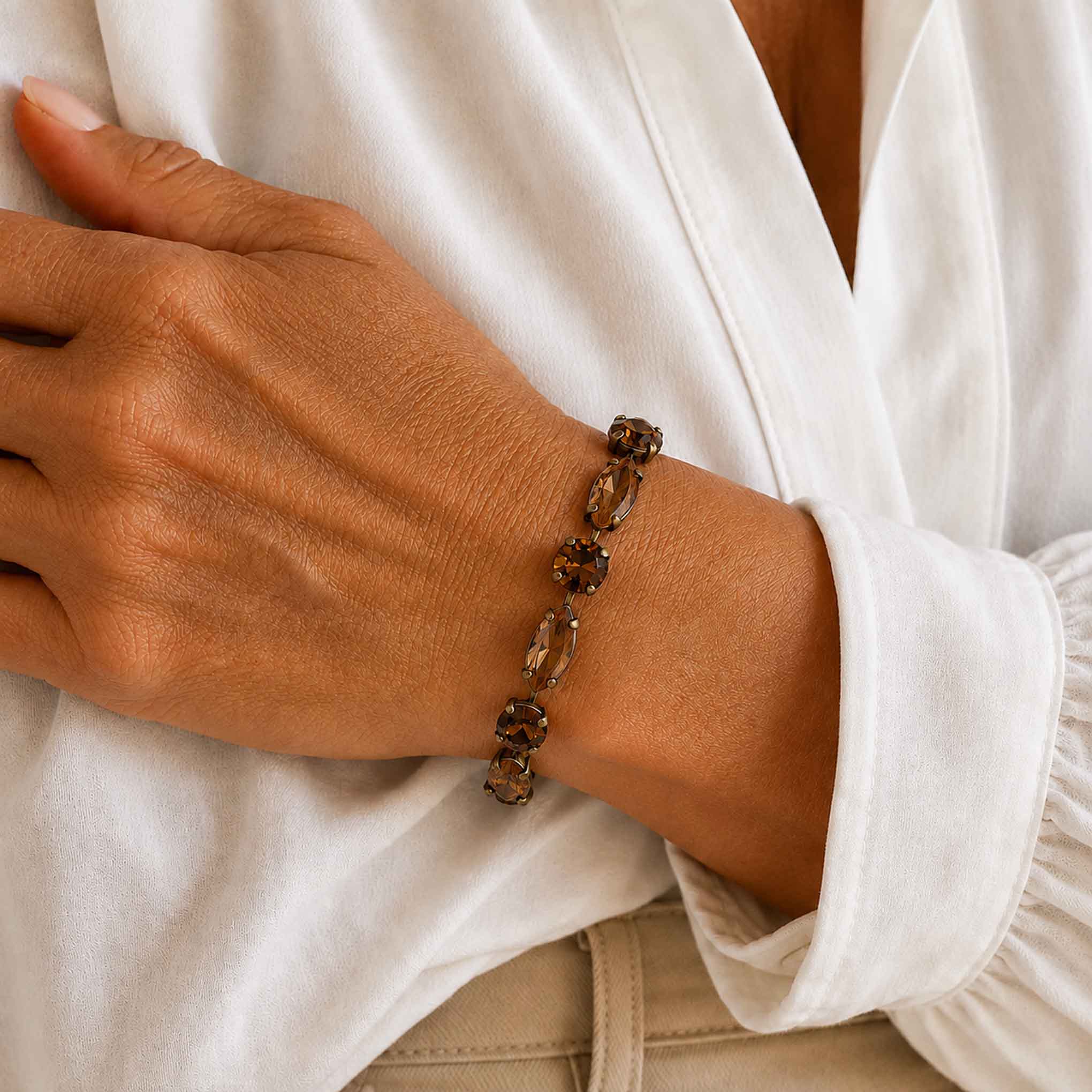 Model wearing brown topaz crystal bracelet by Petite Margaux.