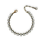 Vintage inspired clear crystal tennis bracelet with contrasting antique brass.