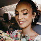 Black bride wearing champagne and clear color crystal drop earrings.